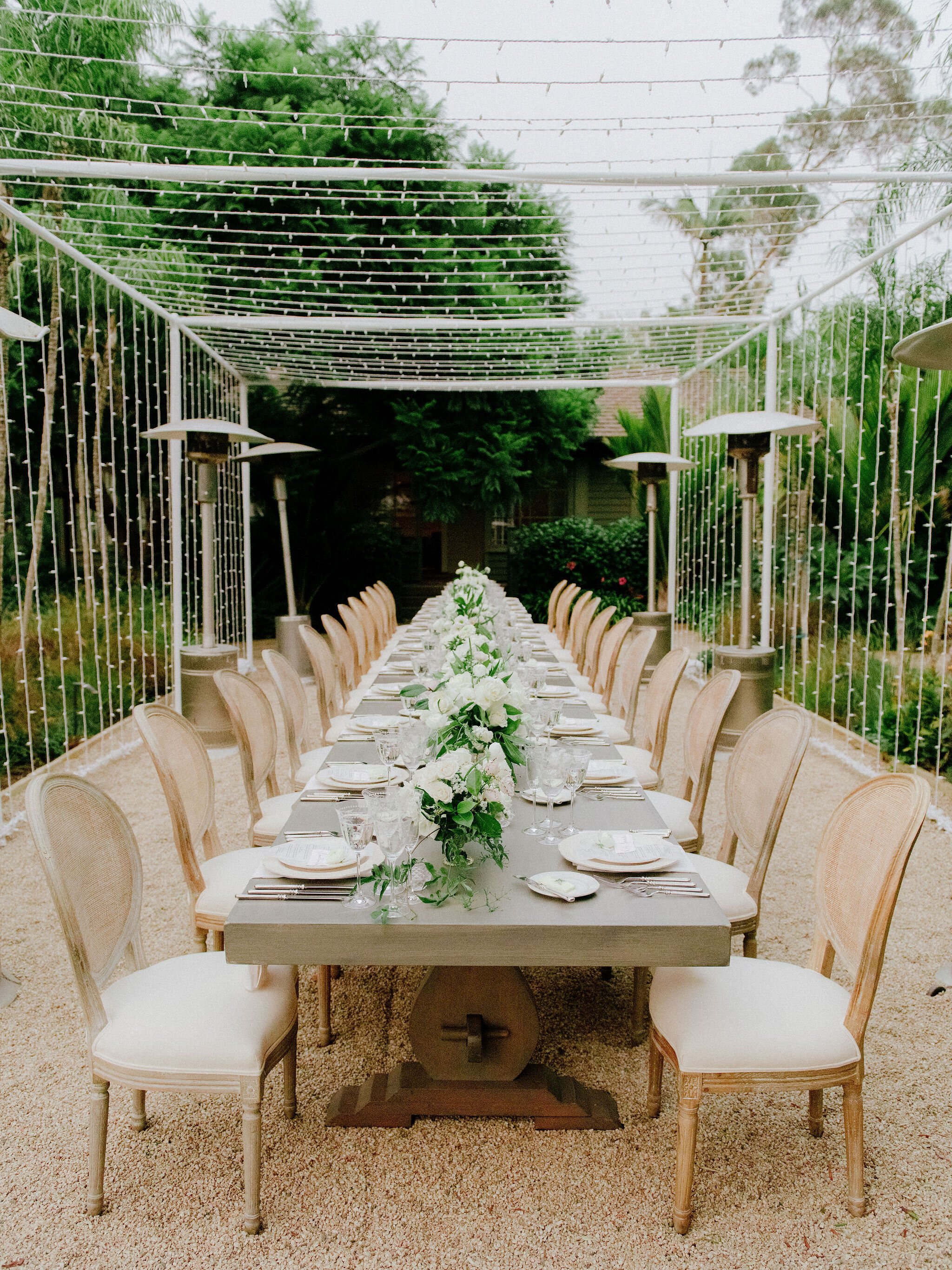 www.santabarbaraweddings.com | Chris J. Evans | Private Residence | Ashley Chanel Events | Rogue &amp; Fox | Reception Table Covered by String Lights