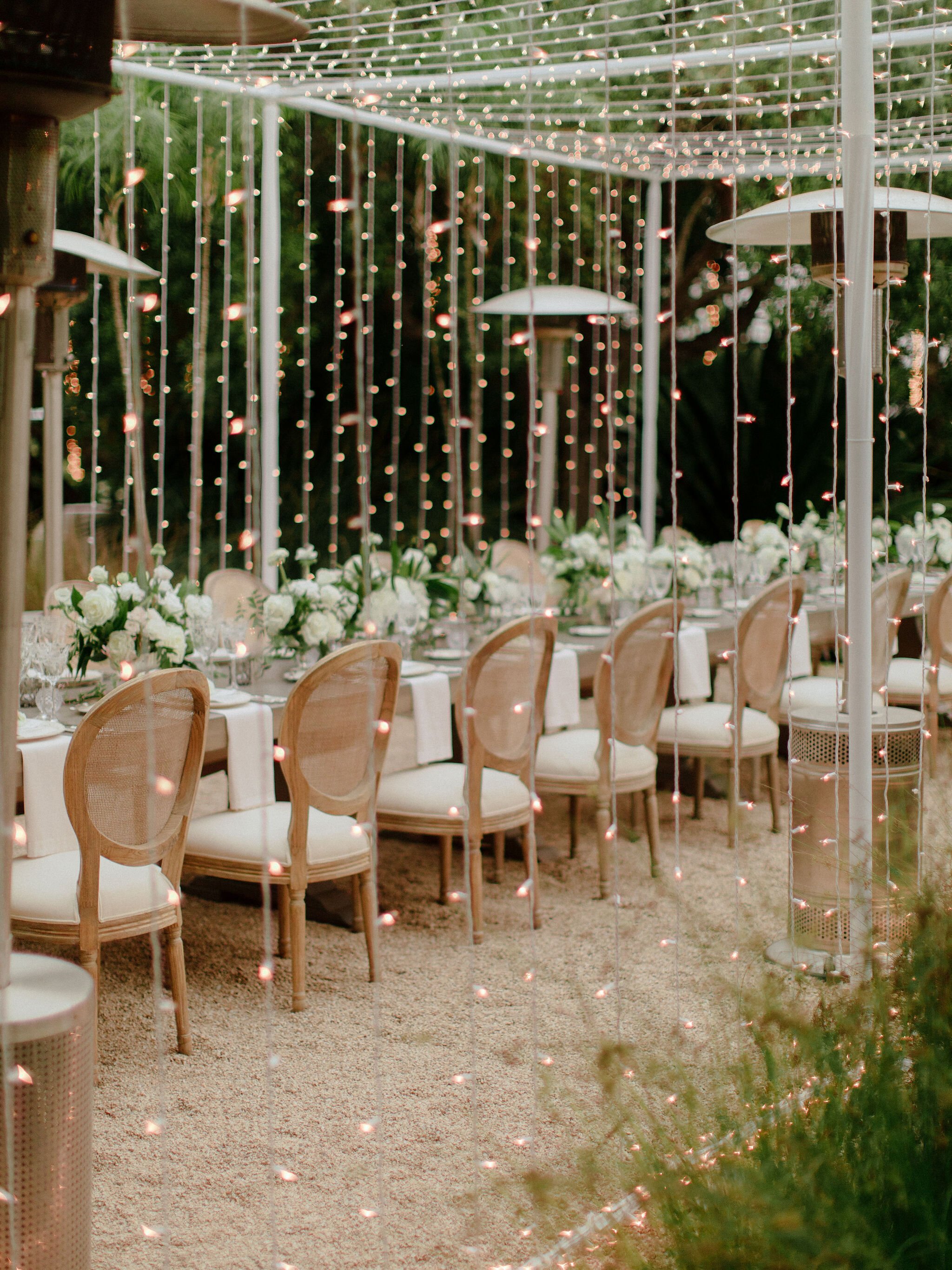 www.santabarbaraweddings.com | Chris J. Evans | Private Residence | Ashley Chanel Events | Rogue &amp; Fox | Reception Table at Night Covered by String Lights
