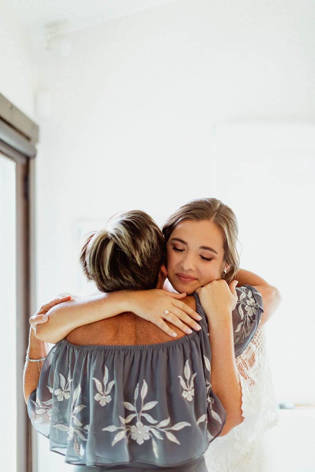 www.santabarbarawedding.com | Holcomb &amp; Co. | SB Courthouse | LuckEleven Events | Bright Floral Design | Chloe Schlossmann | Bride Hugging Her Mom