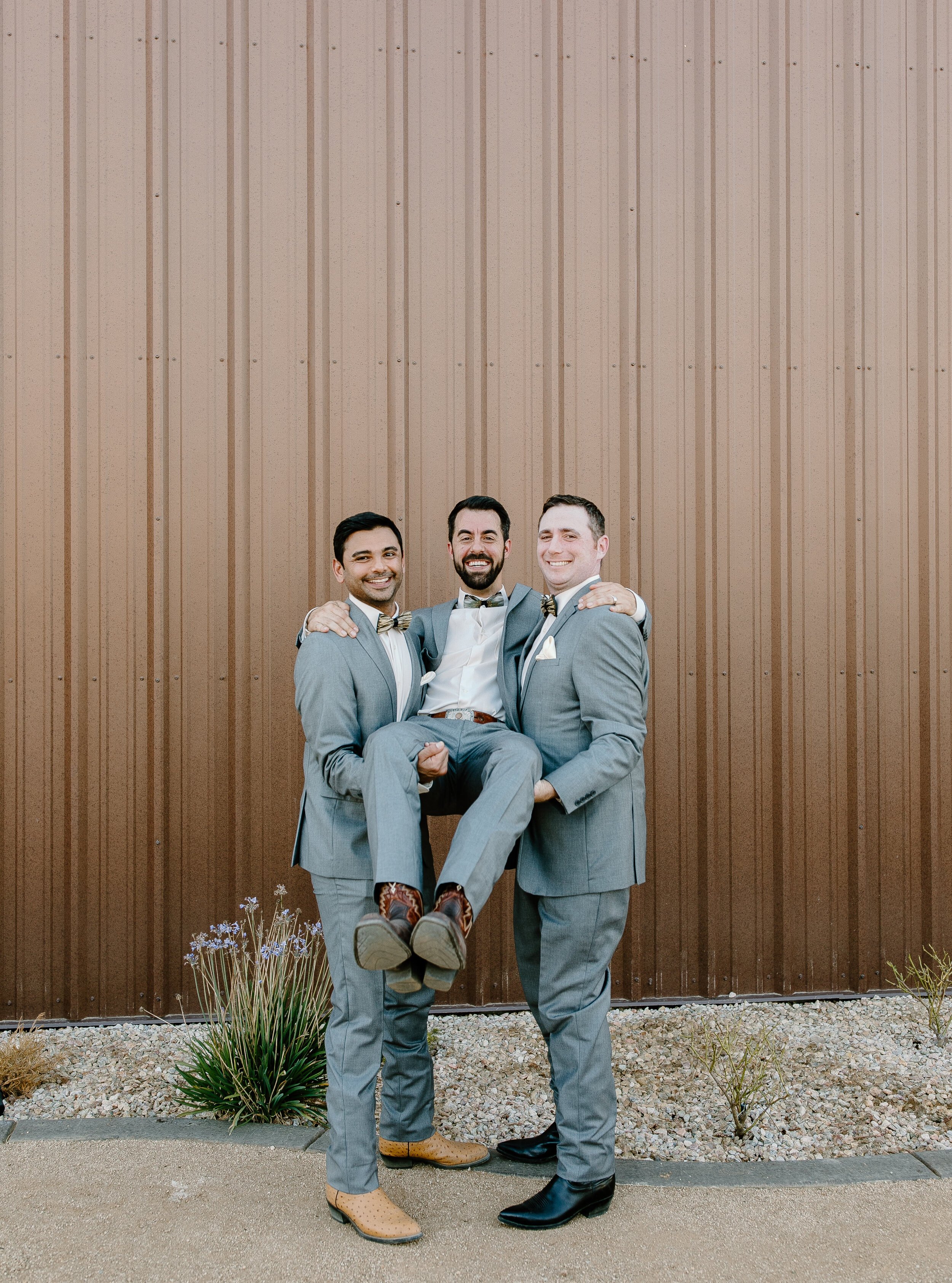 www.santabarbarawedding.com | Events by Fran | Becca Romero Creative | Unique Floral Designs | Groomsmen Holding Up the Groom