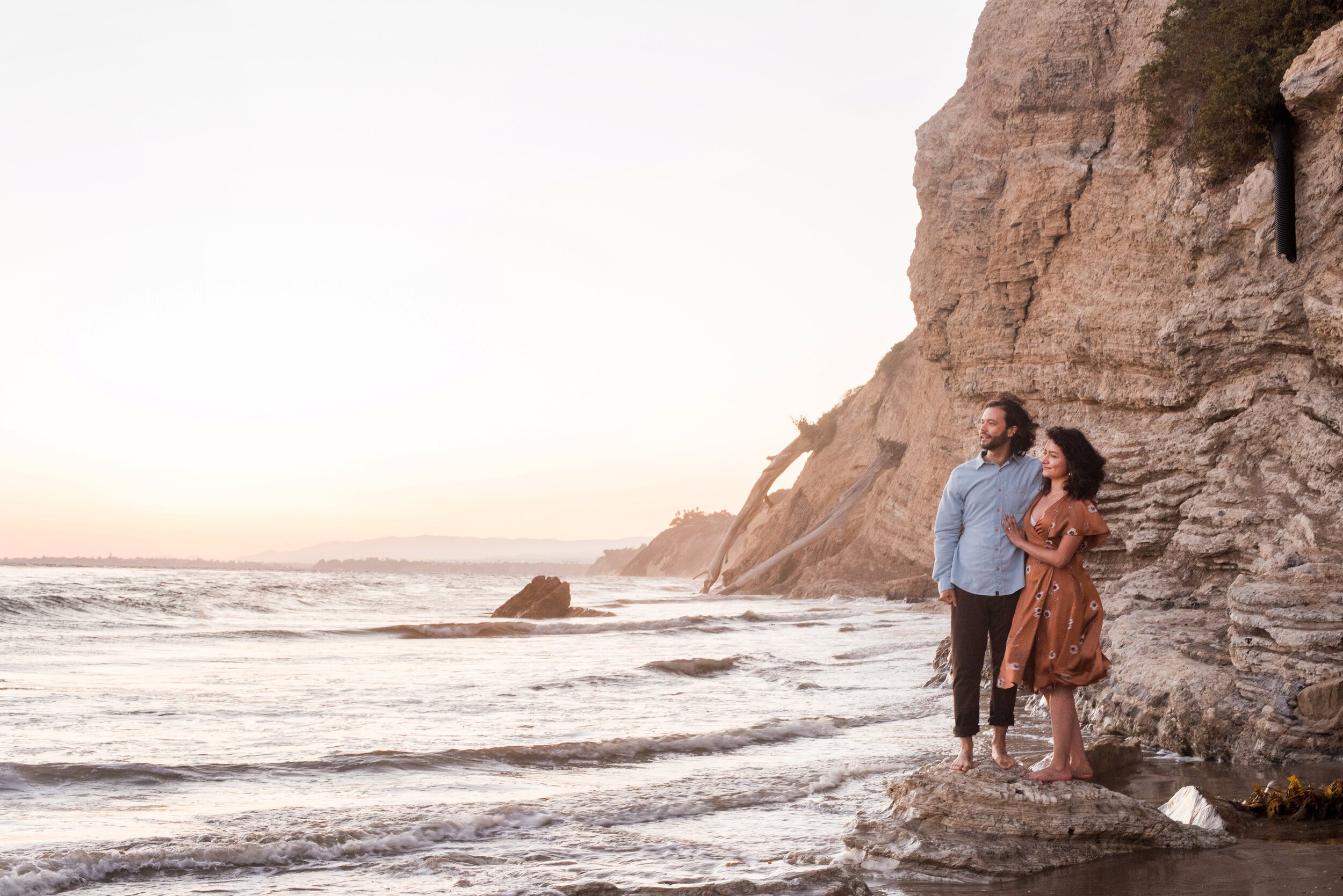 www.santabarbarawedding.com | ByCherry Photography | Mesa Lane Beach | Couple Standing on the Rocks by the Ocean