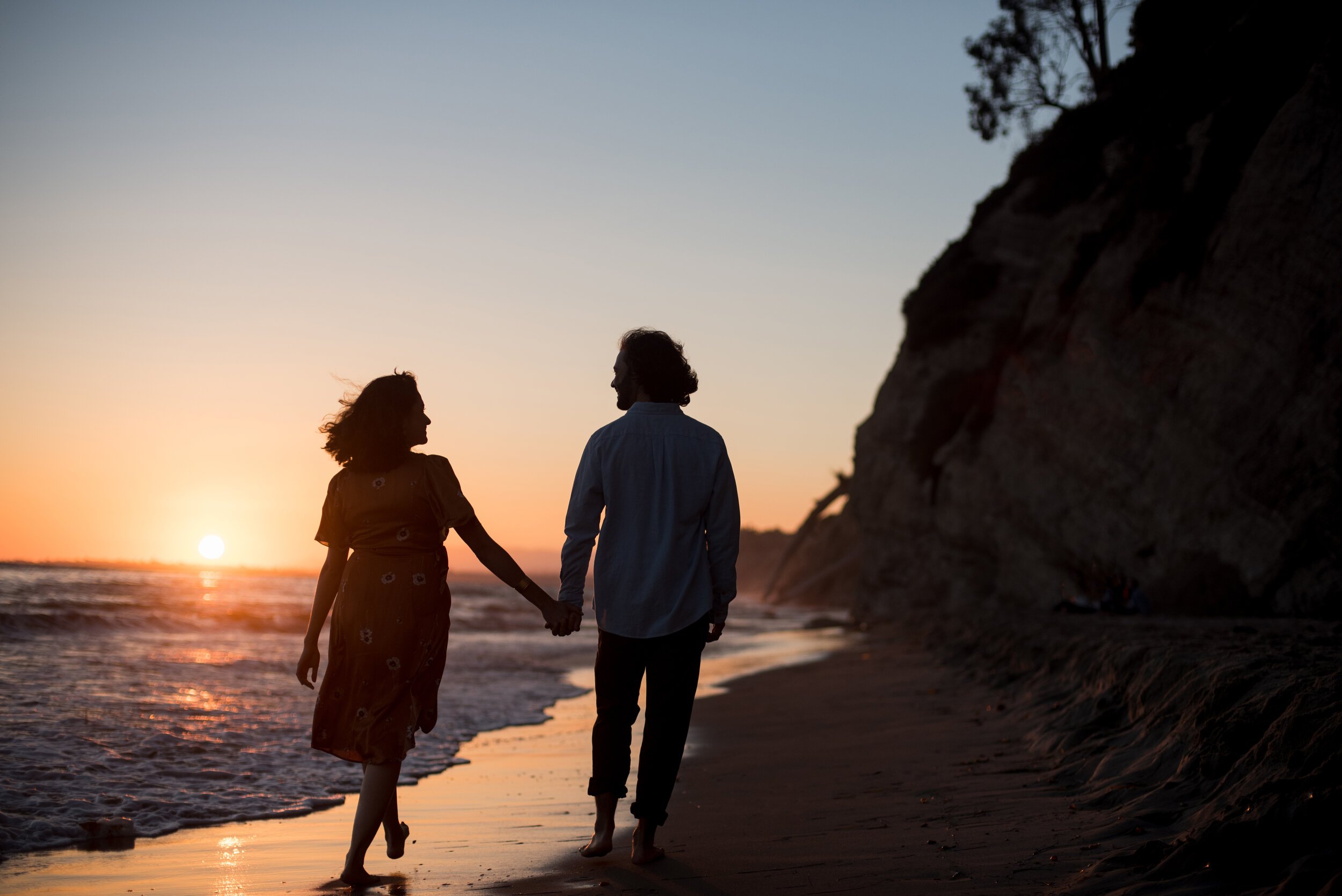 www.santabarbarawedding.com | ByCherry Photography | Mesa Lane Beach | Couple Walking Along the Beach at Sunset