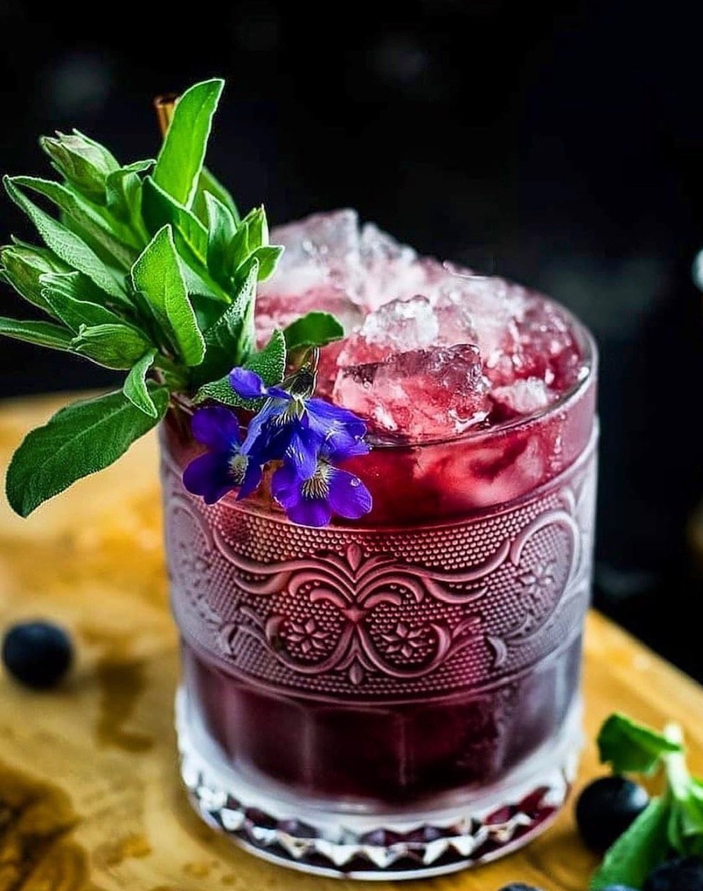 www.santabarbarawedding.com | HeartNSoul Mixology | Purple Cocktail with Greens and Blue Flower Garnish 