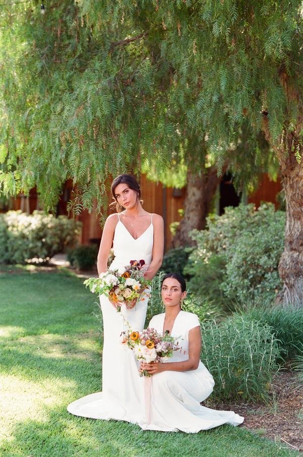 www.santabarbarawedding.com | Roblar Winery | Lerina Winter | Boheme Events | Intrepid Floral Co. | Lovely Bride | Dreamcatcher Artistry | Both Brides Posing with Bouquets 