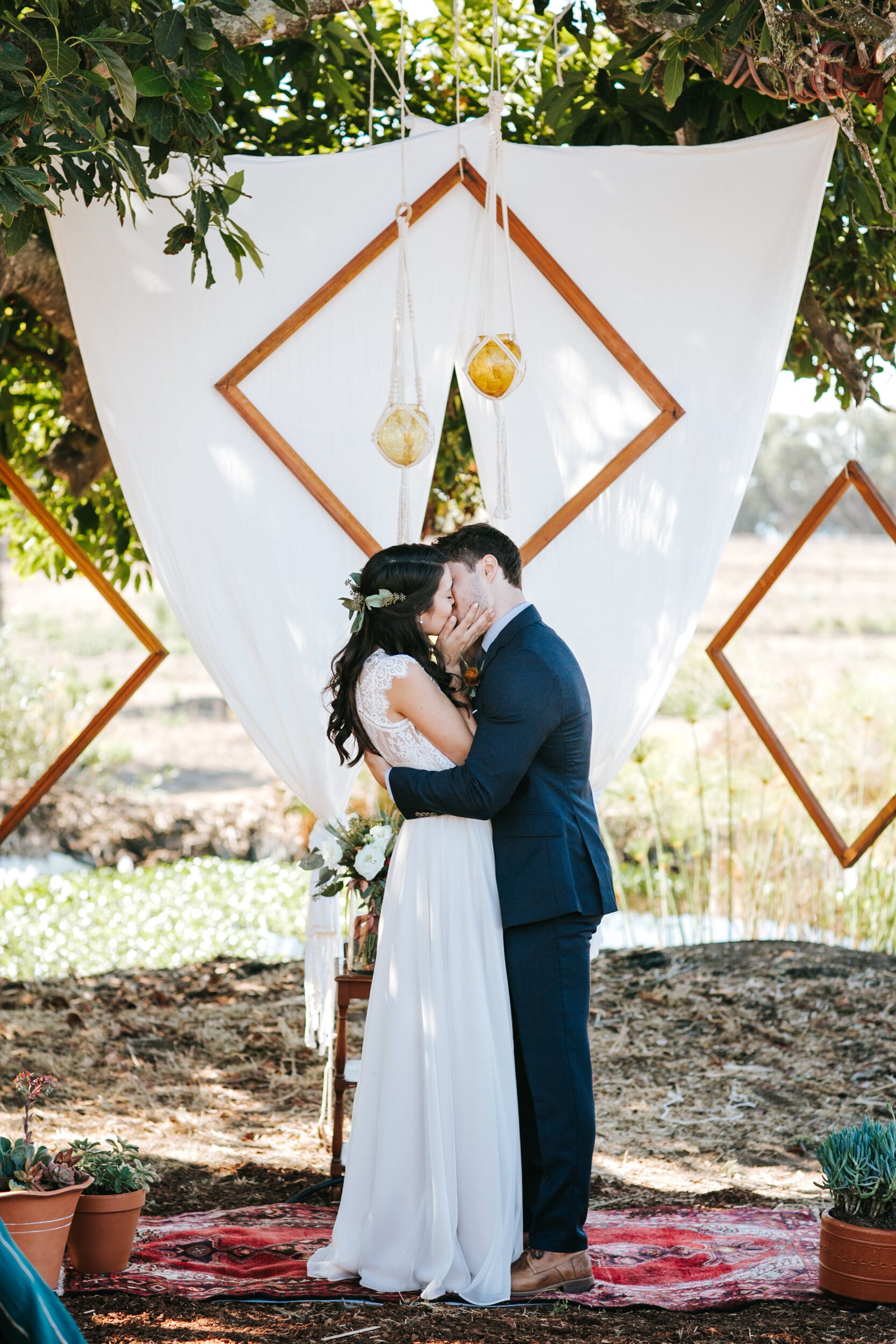 www.santabarbarawedding.com | Elli Lauren Weddings | Dos Pueblos Orchid Farm | Rebekah Xiques | Suzanne Xiques | The Tent Merchant | Tommy Coppers | Bride and Groom First Kiss at Ceremony 
