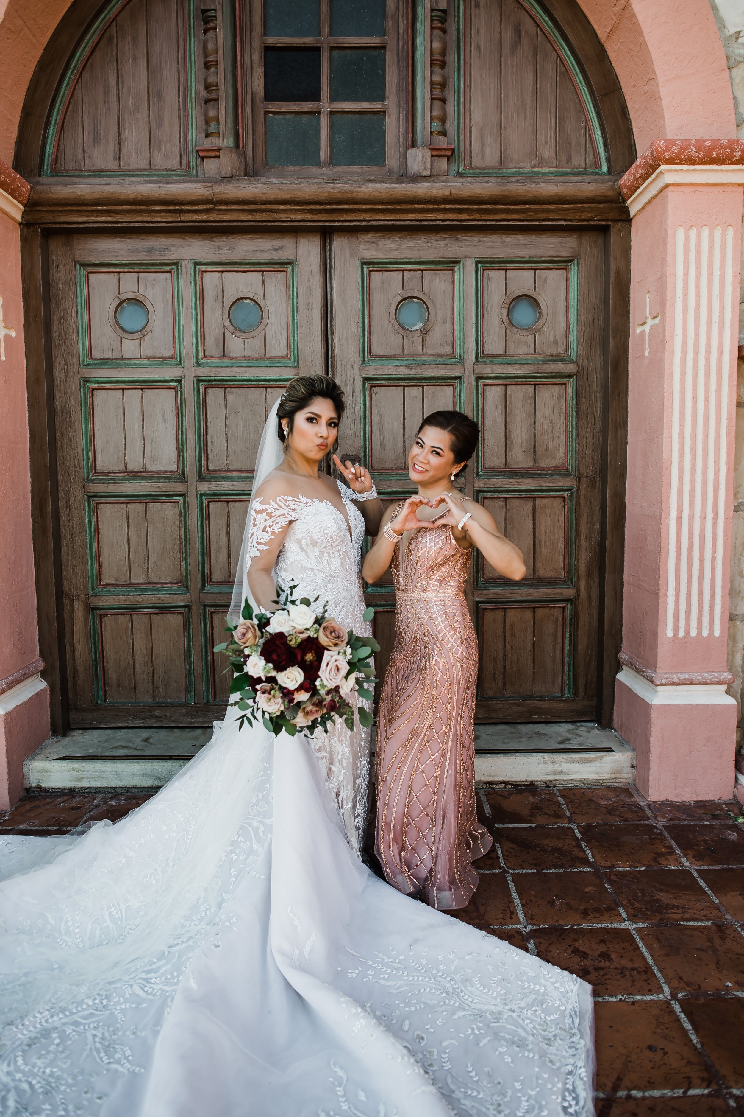 www.santabarbarawedding.com | Old Mission SB | Events by Maxi | Michelle Ramirez | Tangled Lotus | Bride and Bridesmaid in Front of the Church