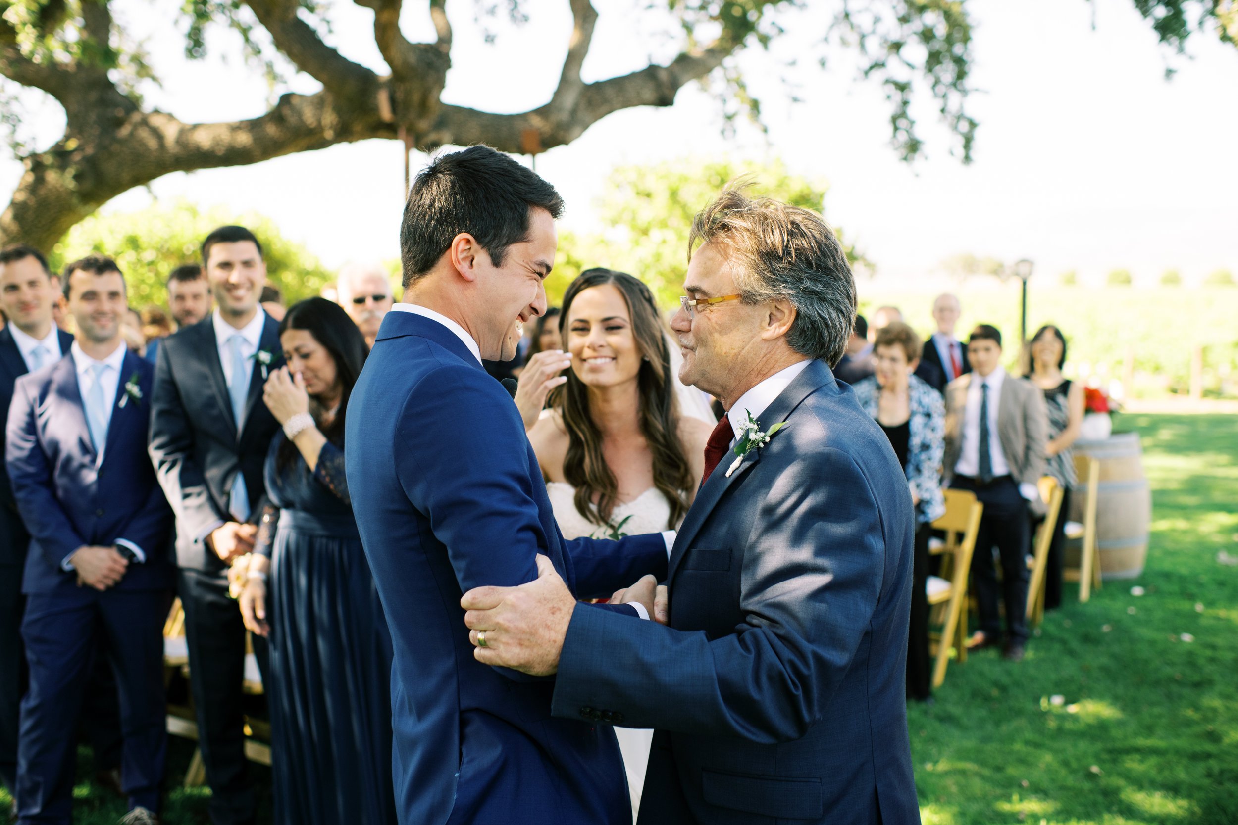 www.santabarbarawedding.com | Loveridge Photography | Gainey Vineyard | Amber Alyse Events | Bright Event Rentals | Lucky Devils Band | Father of the Bride Embracing the Groom 