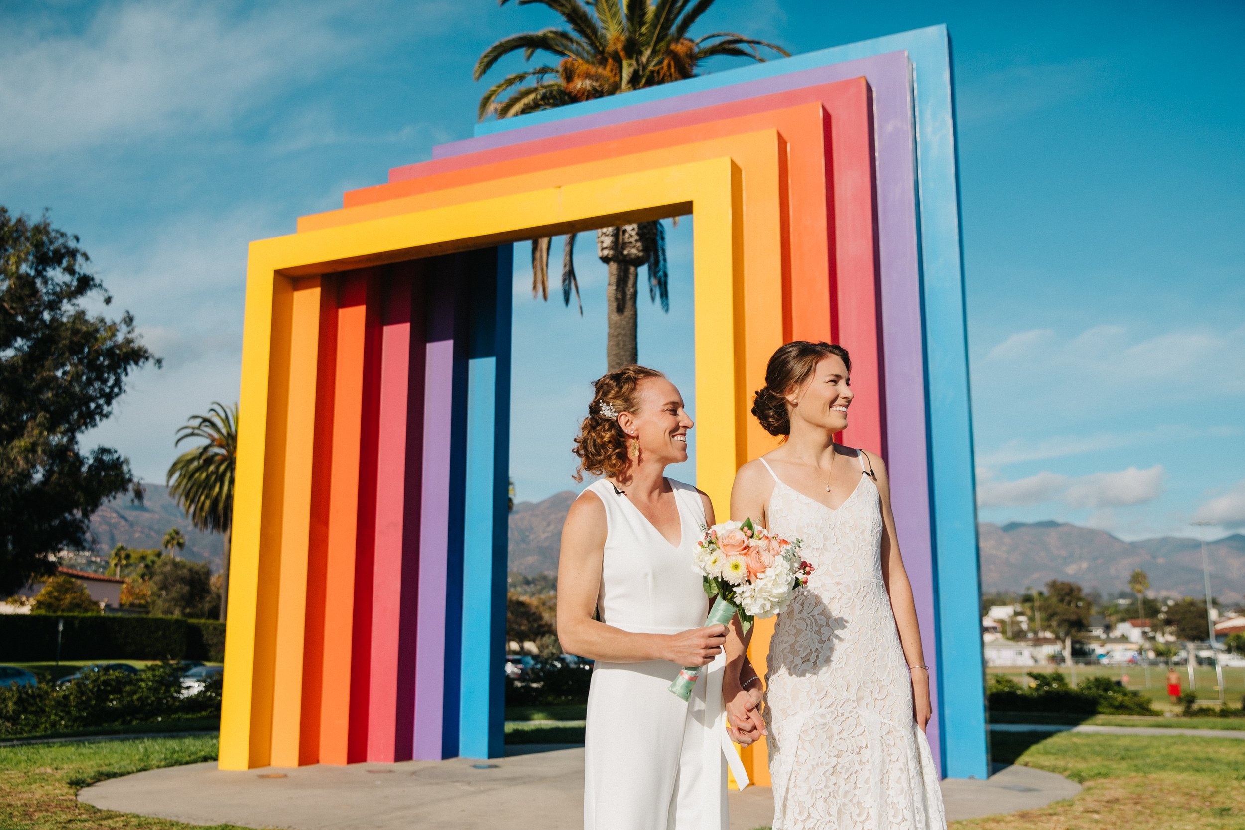 www.santabarbarawedding.com | Lerina Winter | Danny Miles | Nordstrom | Lulus | Walter Claudio Studio | Chromatic Gate | Brides in Front of the Rainbow Arch 