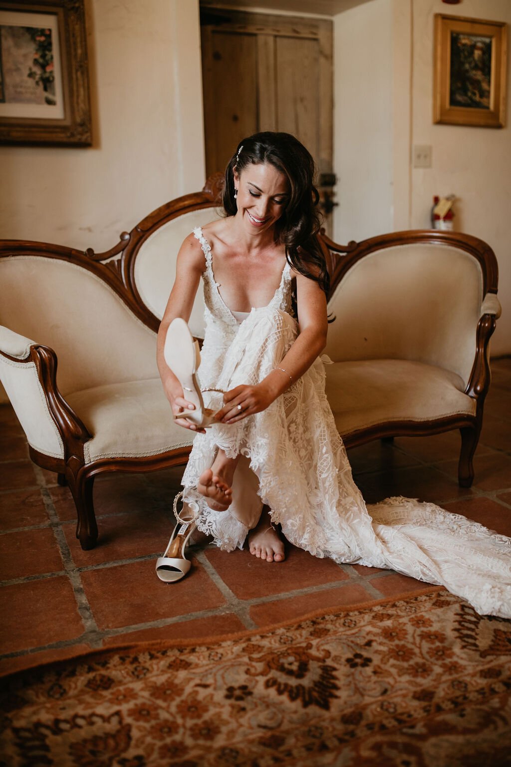 www.santabarbarawedding.com | Felici Events | SB Historical Museum | Ashley Taylor Photography | Ella &amp; Louie | LunaBella | Bride Putting on Shoes