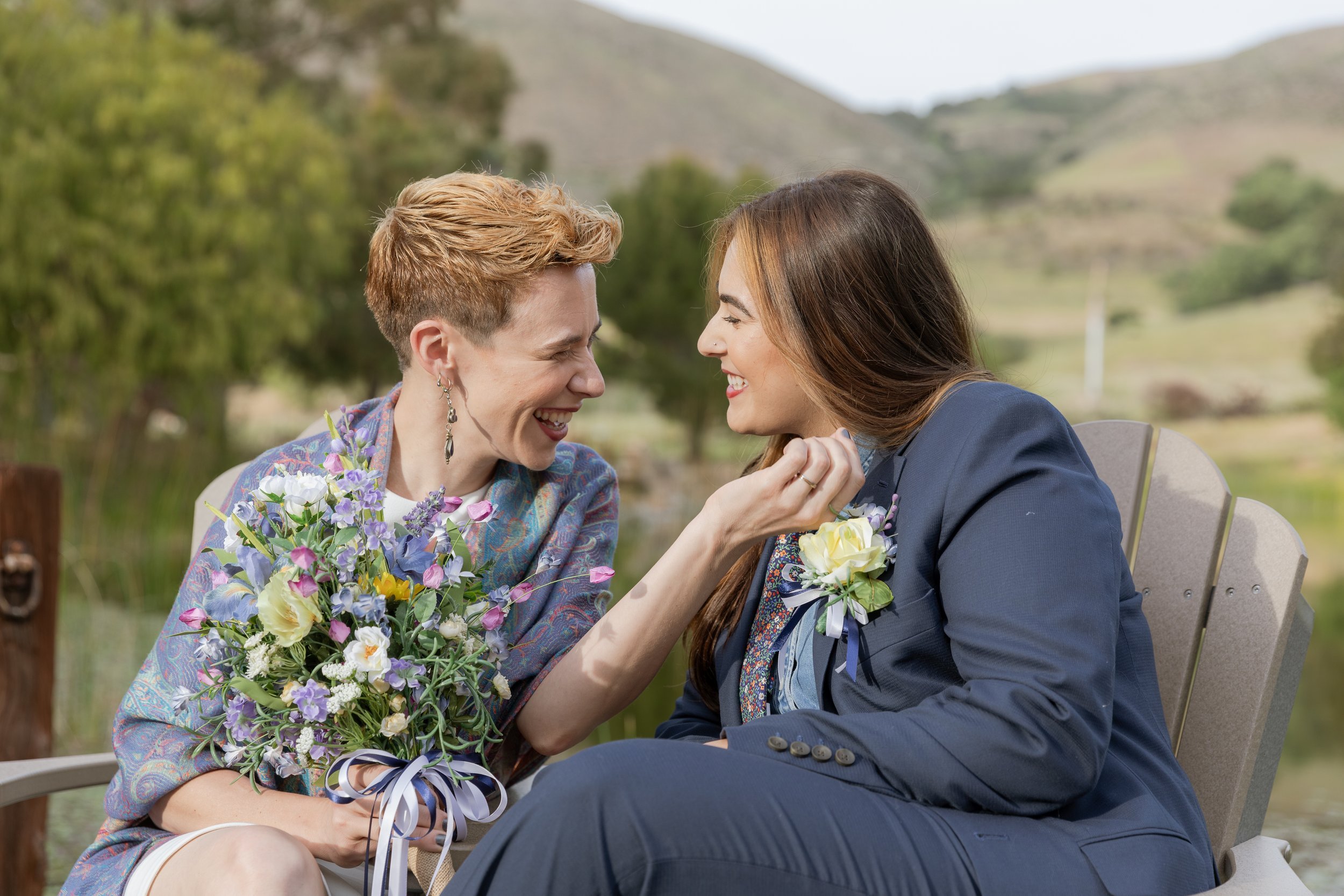 www.santabarbarawedding.com | MacKenzie Rana Photography | Fish House San Luis Obispo | Couple Sitting Together with Bouquet at Engagement Shoot