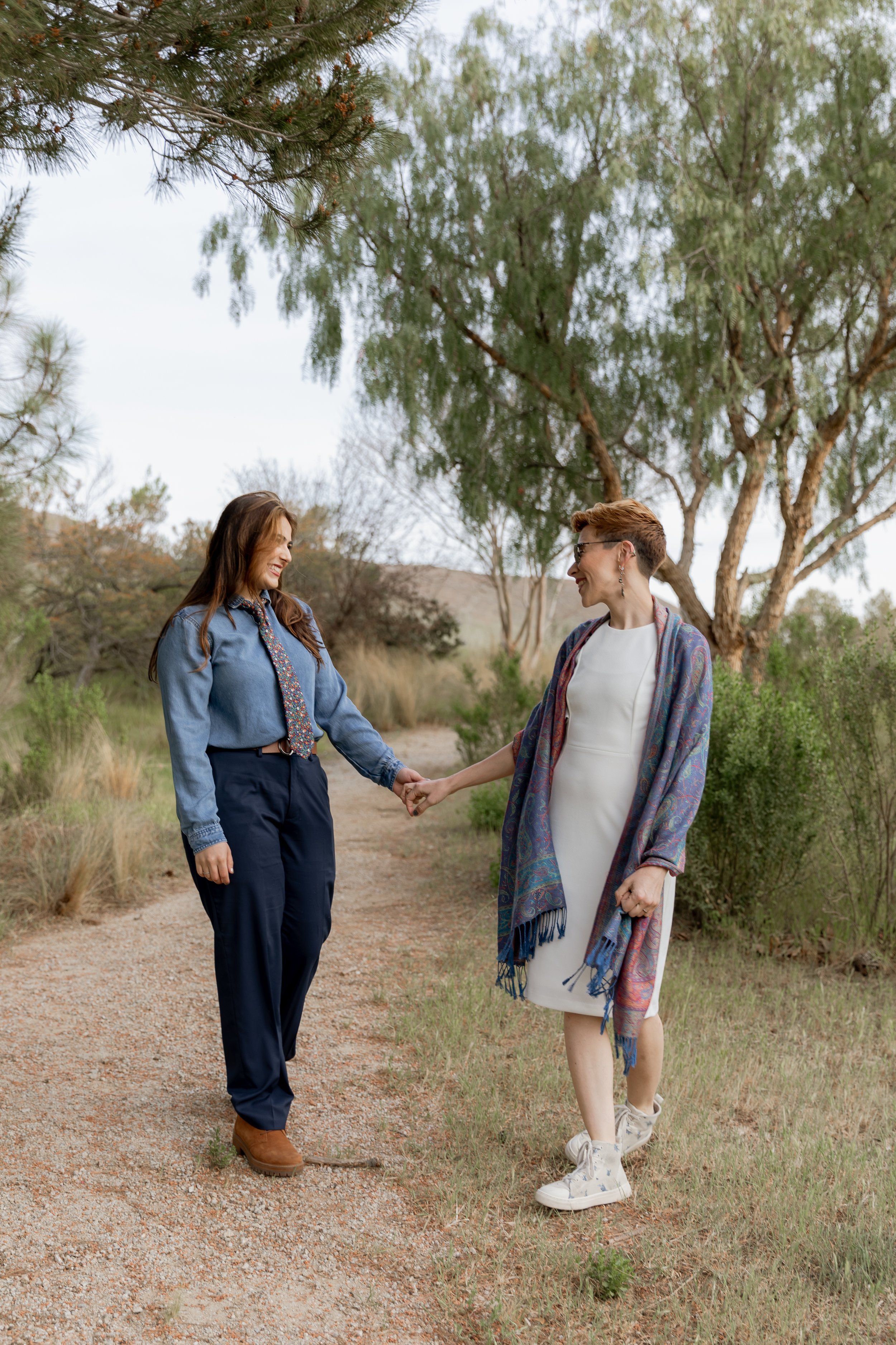 www.santabarbarawedding.com | MacKenzie Rana Photography | Fish House San Luis Obispo | Couple Hand in Hand on Hiking Path at Engagement Shoot