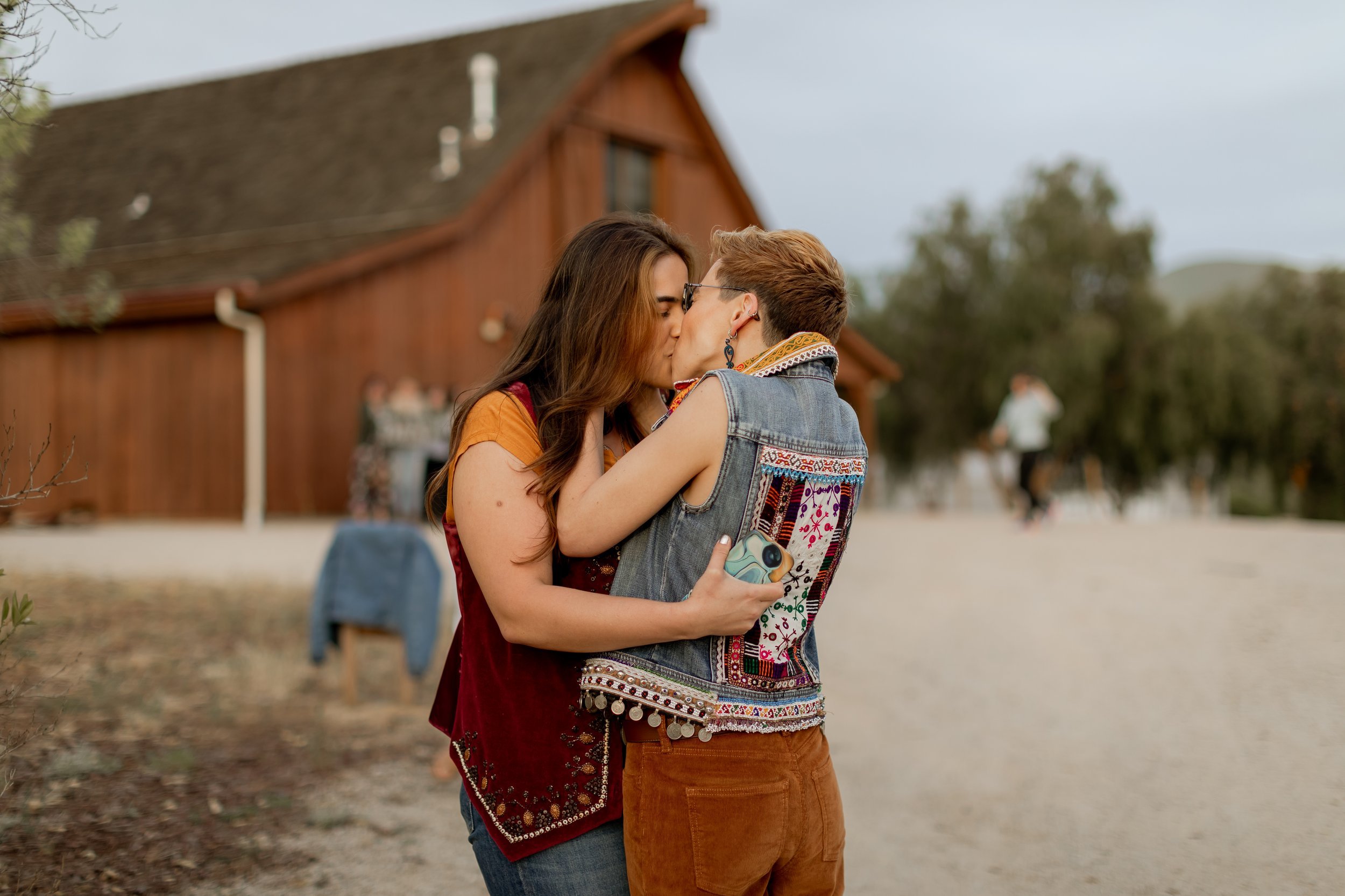 www.santabarbarawedding.com | MacKenzie Rana Photography | Fish House San Luis Obispo | Couple Kissing After Proposal at Engagement Shoot