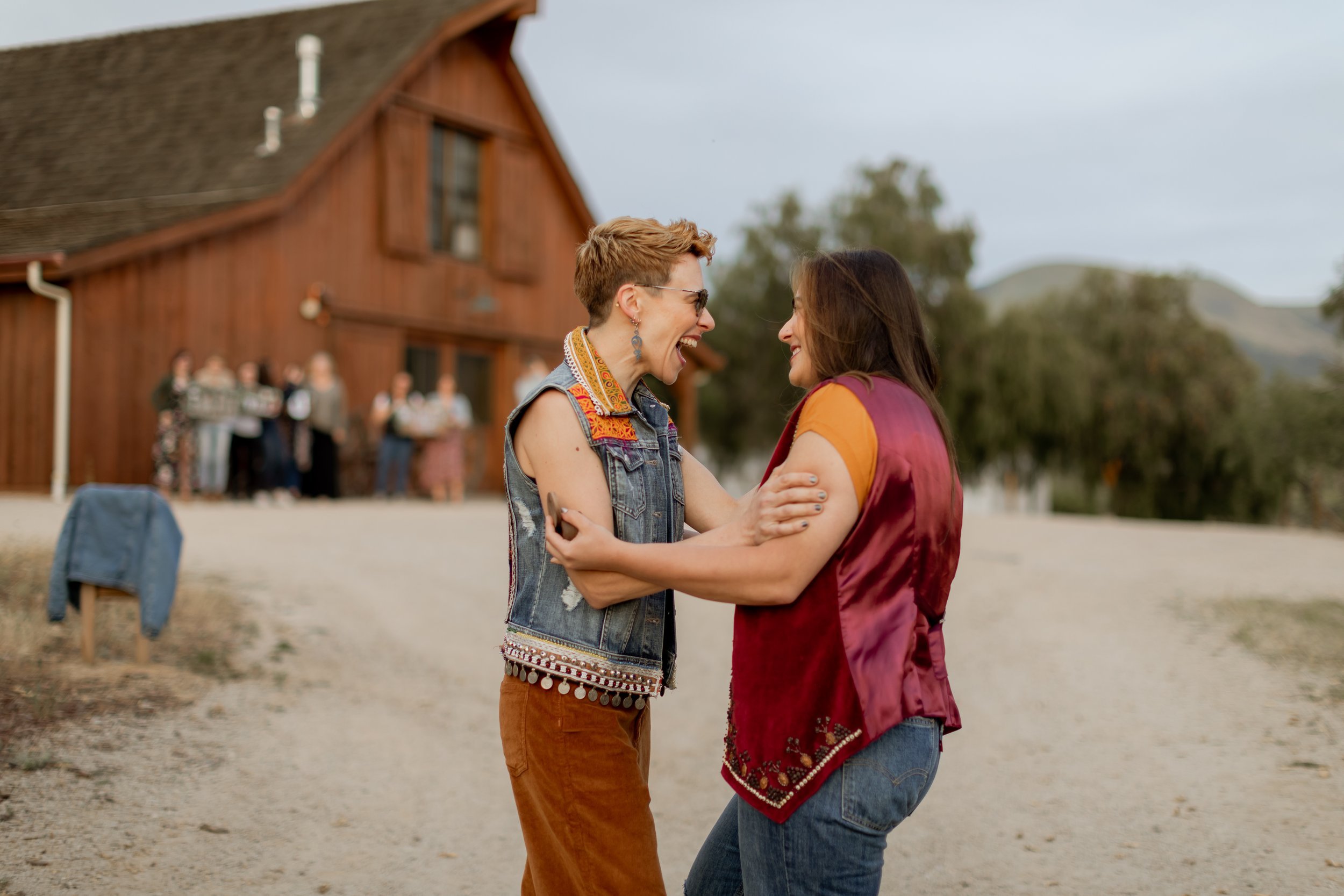 www.santabarbarawedding.com | MacKenzie Rana Photography | Fish House San Luis Obispo | Couple Embracing After Proposal at Engagement Shoot