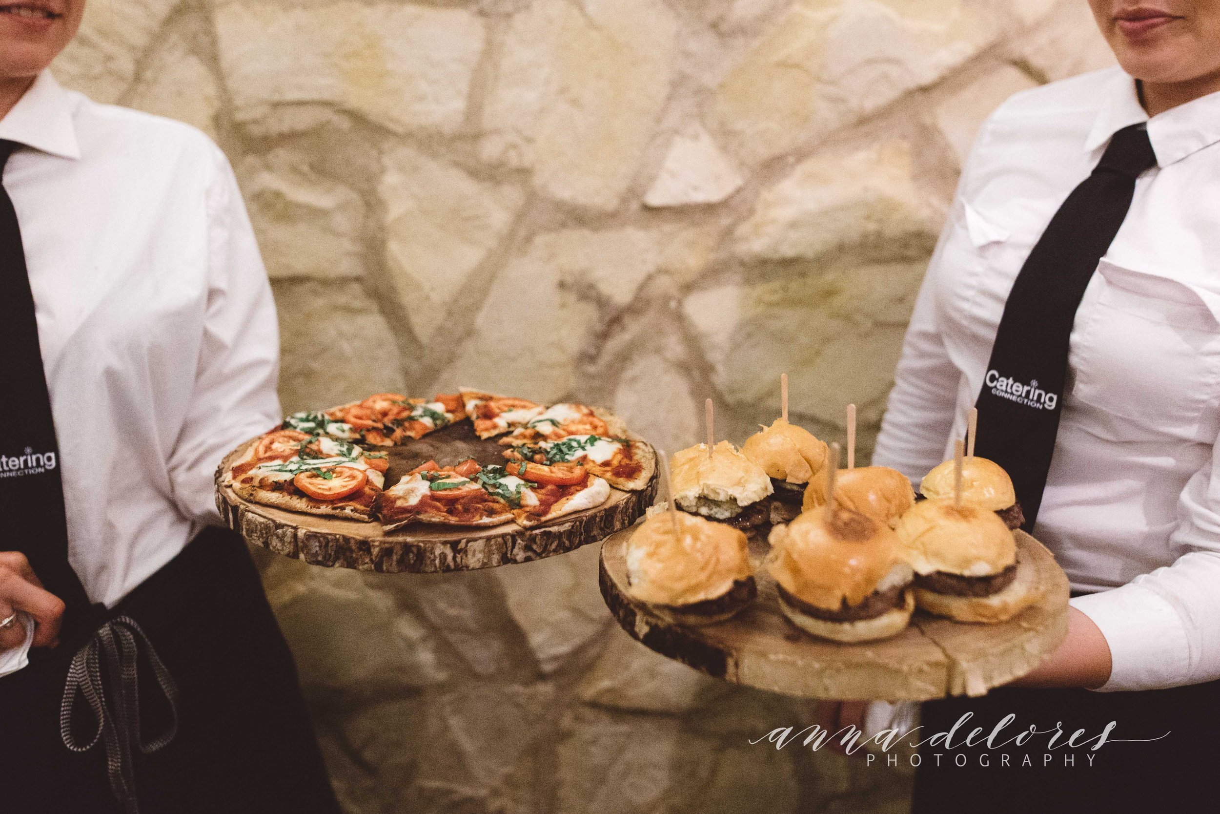 www.santabarbarawedding.com | Catering Connection | Anna Delores Photography | Servers Holding Trays of Appetizers Including Hamburgers