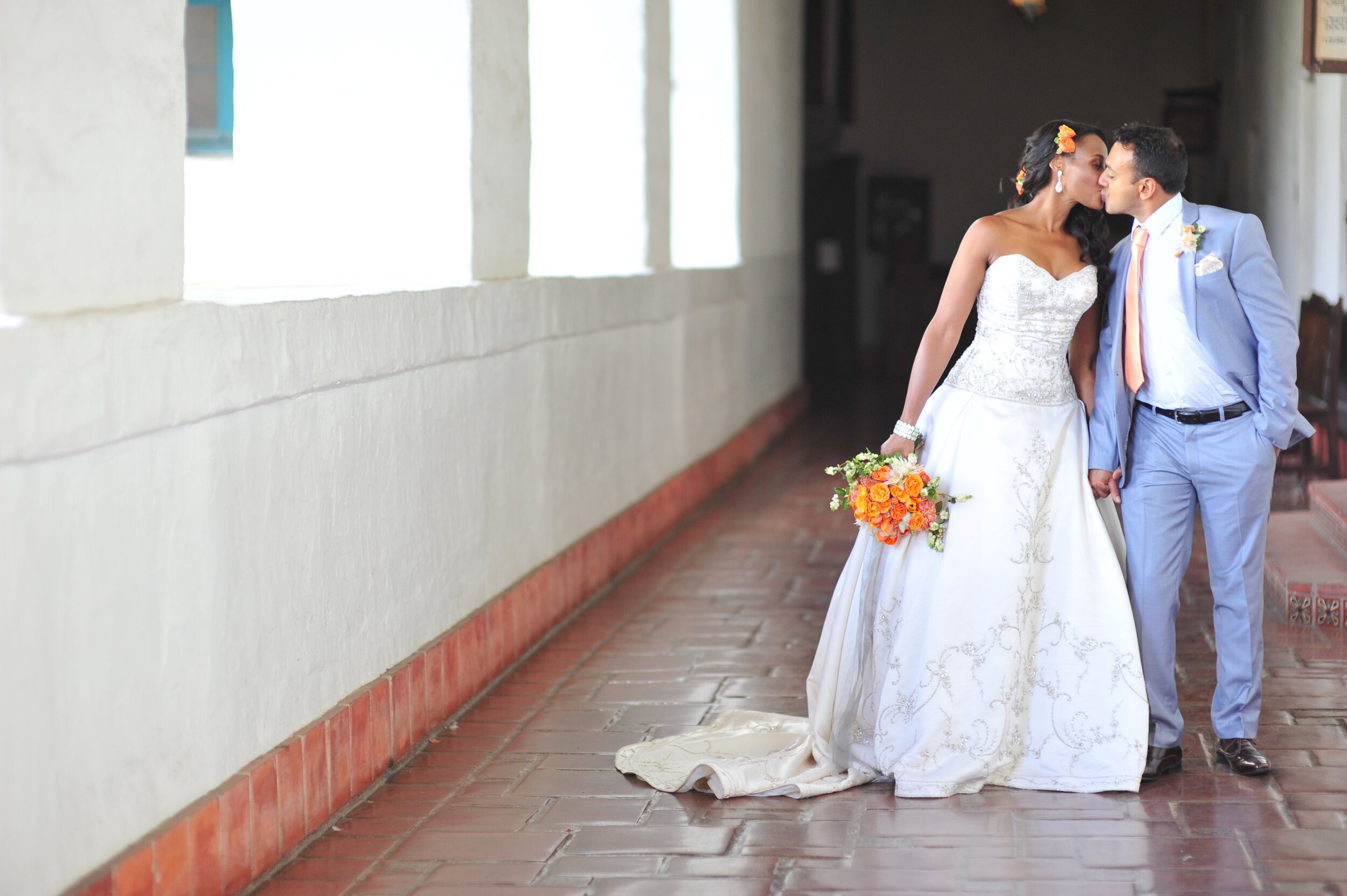 www.santabarbarawedding.com | ByCherry Photography | Dalina Klan | Four Seasons Resort The Biltmore | Cheryl Nacario | Bride and Groom Kiss in the Hallway