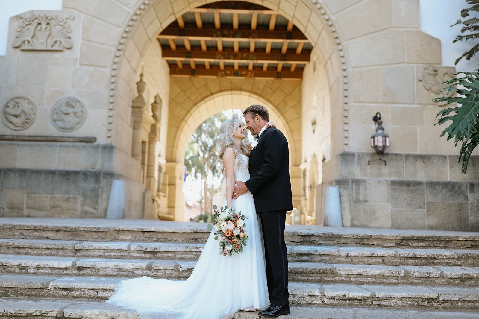 www.santabarbarawedding.com | Santa Barbara Courthouse | Blink Aesthetics | Santa Barbara Classic Weddings | The Dress Bride | Alexis Ireland Florals | Couple on the Courthouse Stairs