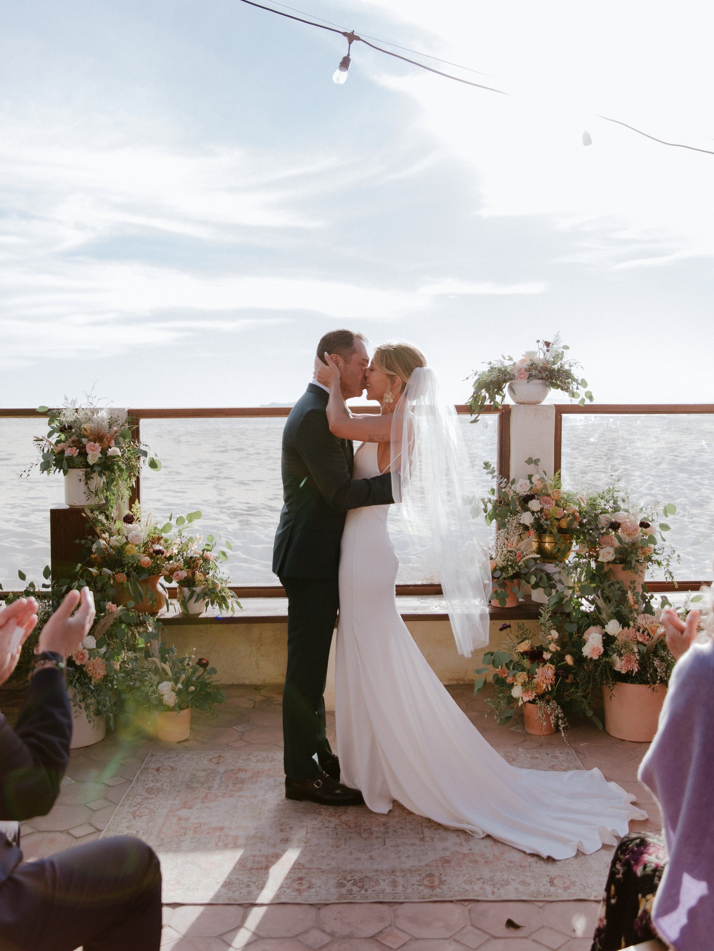 www.santabarbarawedding.com | Chris J. Evans | Paul Smith Suits | Bride and Groom Kissing at the Ceremony 