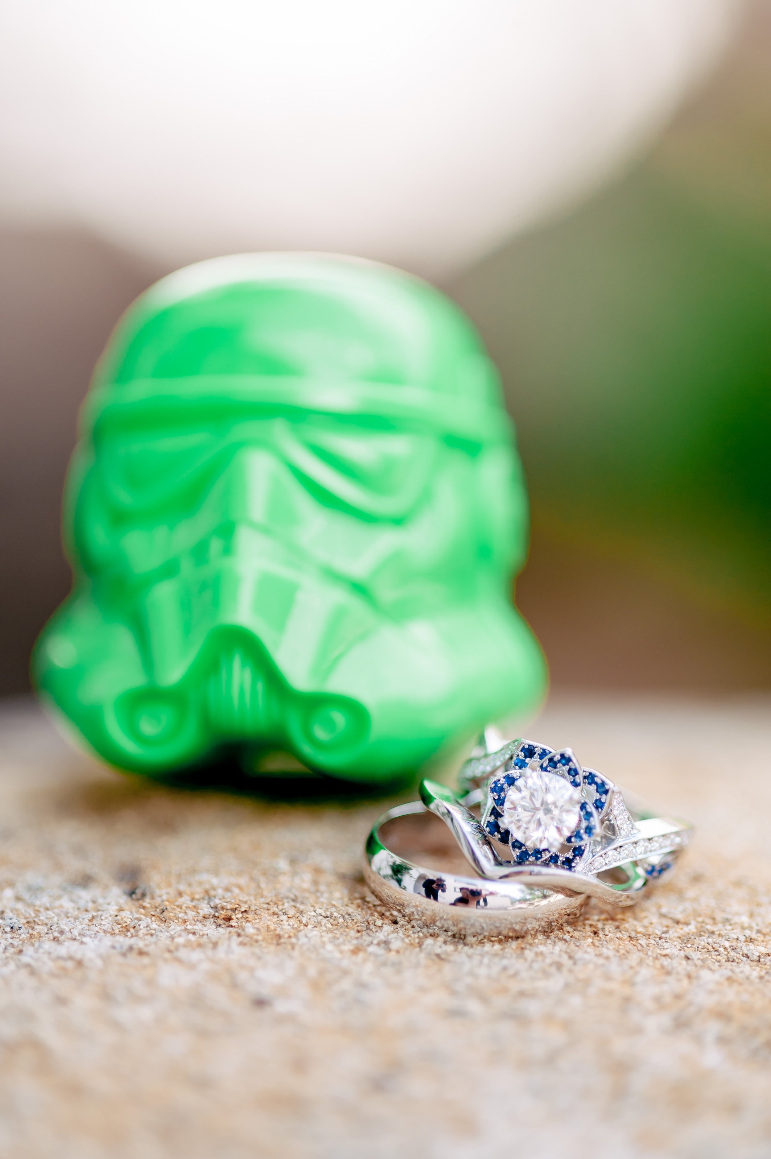 www.santabarbarawedding.com | Rewind Photography | Burlap and Bordeaux | Wedding Rings Next to Green Storm Trooper Head