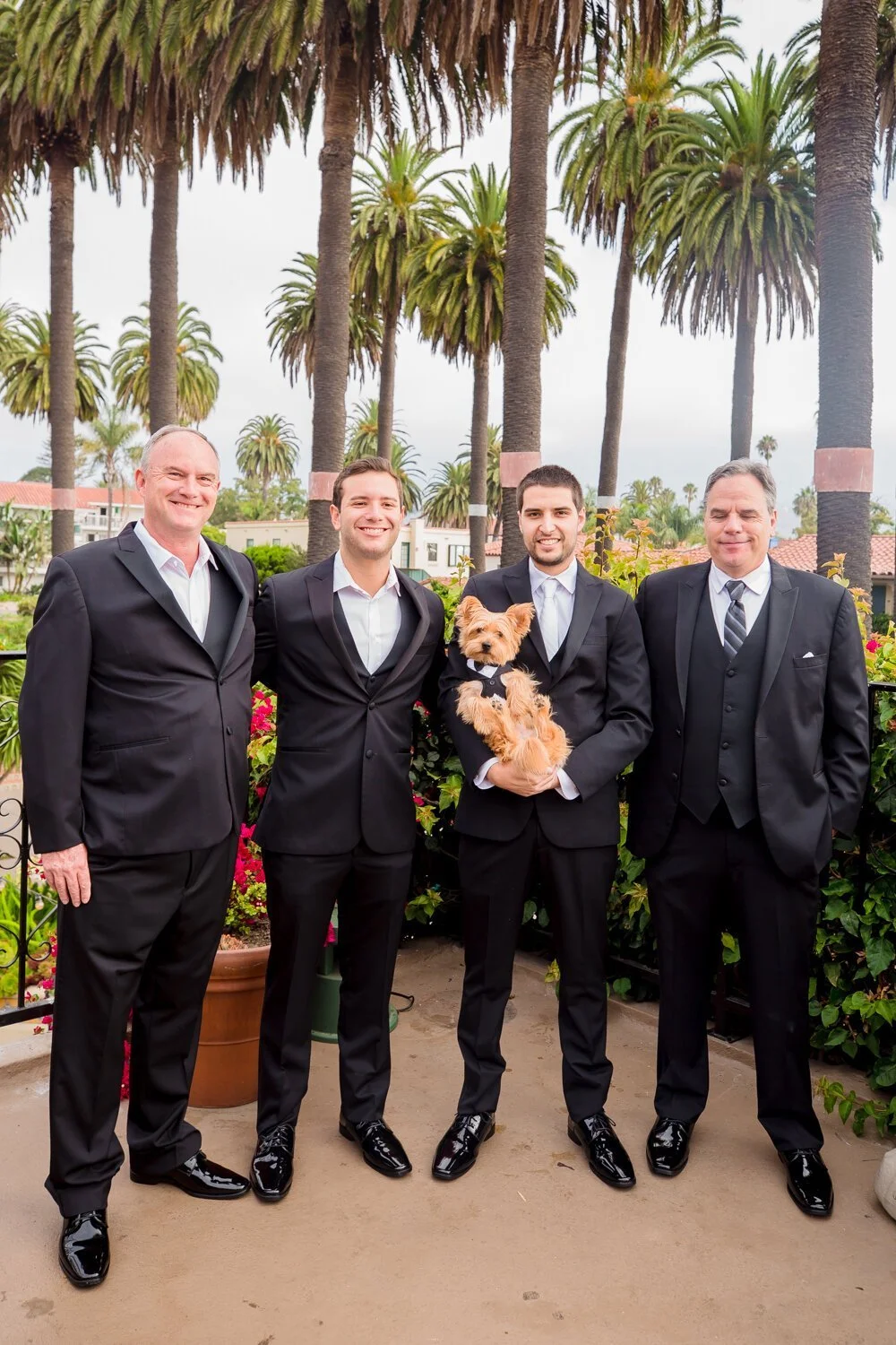 www.santabarbarawedding.com | Kiernan Michelle Photography | Santa Barbara Courthouse | Groom with Groomsmen and Yorkie in a Suit