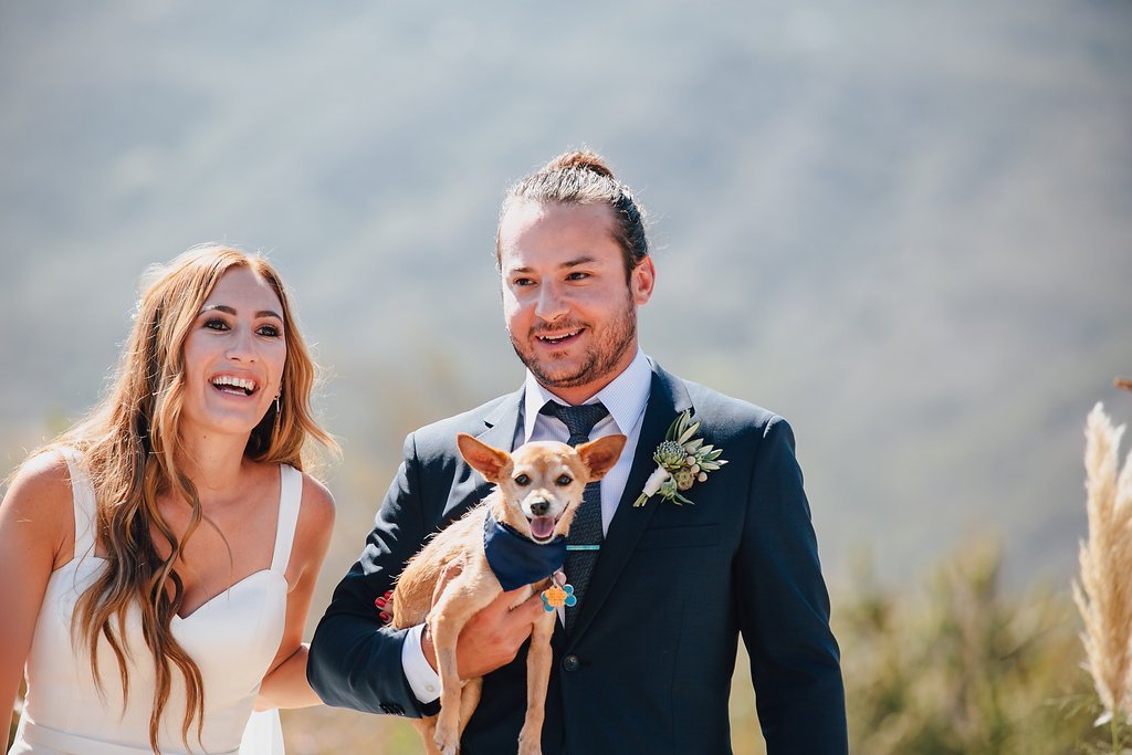 www.santabarbarawedding.com | Marble Rye Photography | Elli Lauren Weddings | Onyx + Redwood | Couple Walking Back Down the Aisle Carrying Their Dog