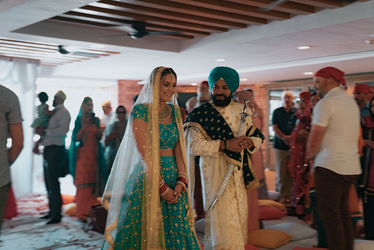www.santabarbarawedding.com | Golden Glow Weddings | Hyatt Ziva Los Cabos | Diego Chavez | Addison Parrish | Bride and Groom Standing at Traditional Indian Ceremony 