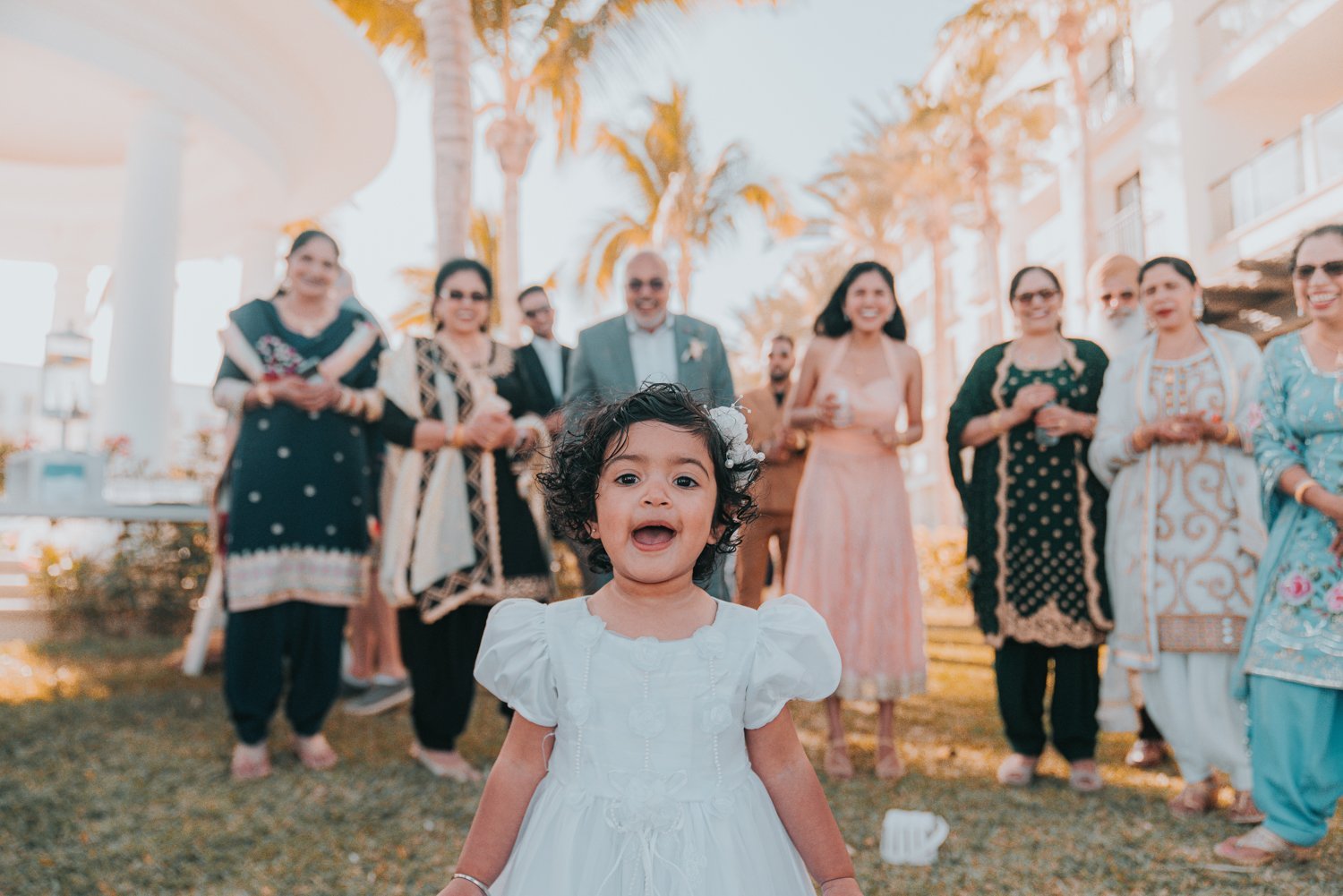 www.santabarbarawedding.com | Golden Glow Weddings | Hyatt Ziva Los Cabos | Diego Chavez | Addison Parrish | Little Girl with Family and Friends at Wedding