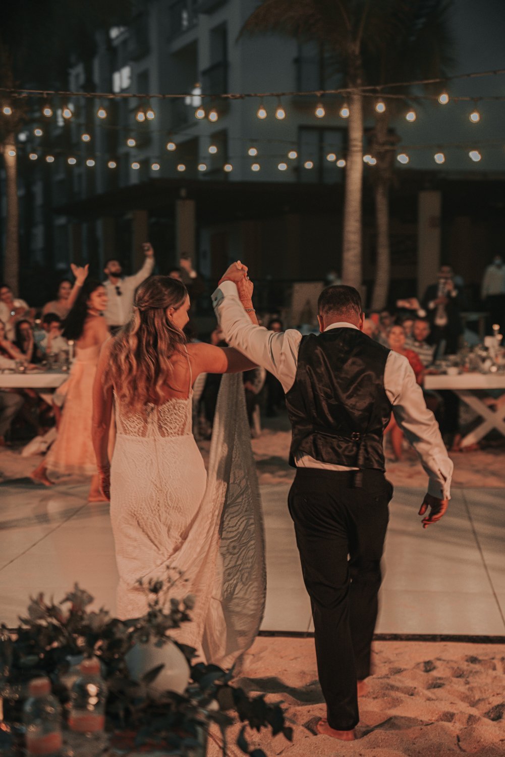 www.santabarbarawedding.com | Golden Glow Weddings | Hyatt Ziva Los Cabos | Diego Chavez | Addison Parrish | Bride and Groom Heading to the Dance Floor at Reception 