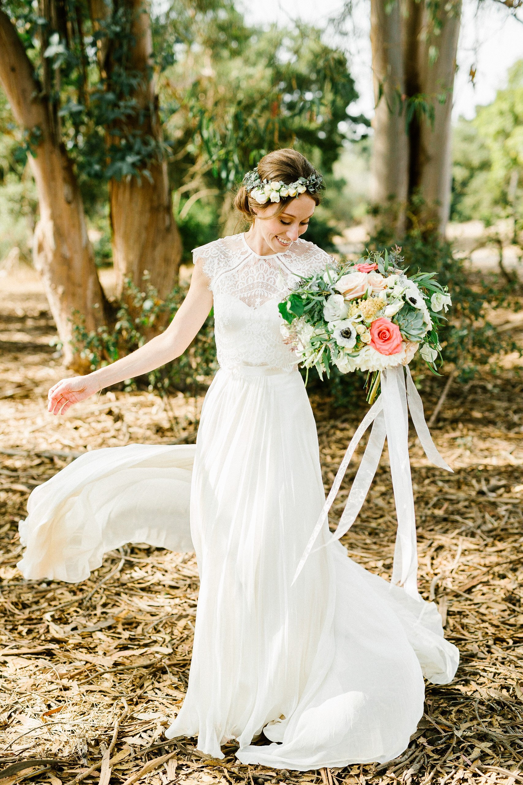 www.santabarbarawedding.com | Elings Park | Hannah Rose Grey Photography | Bride Twirling in the Park with Her Bouquet and Flower Crown