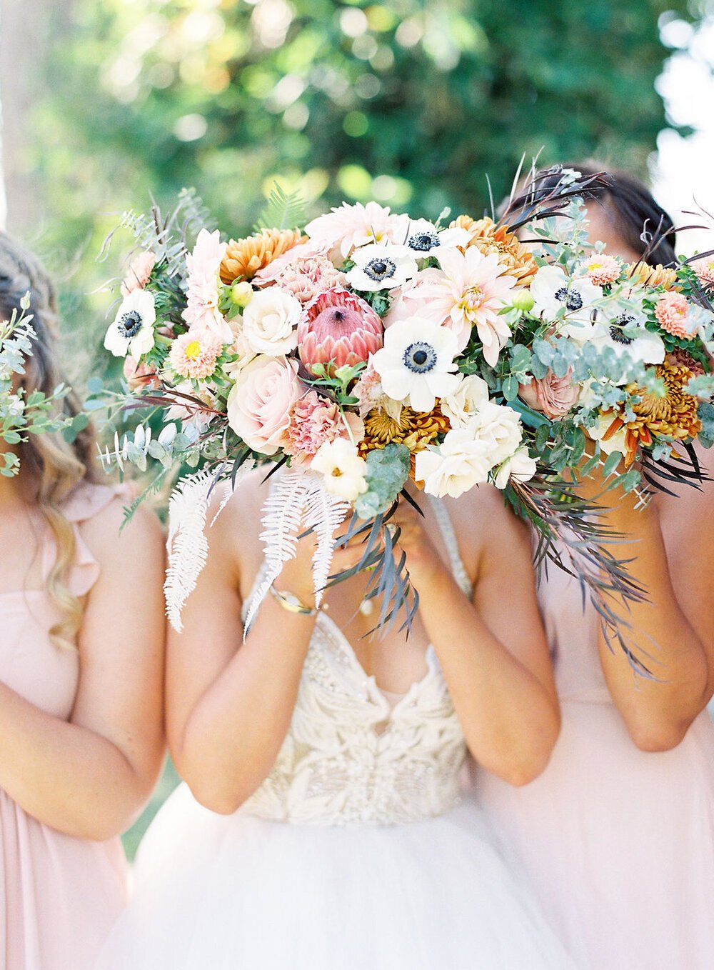 www.santabarbarawedding.com | Danielle Bacon Photography | Twisted Twig | Bride and Bridesmaids Holding Up Bouquets