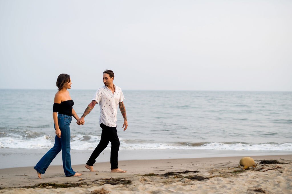 www.santabarbarawedding.com | Julia Franzosa Photography | Newly Engaged Couple Walking on the Beach