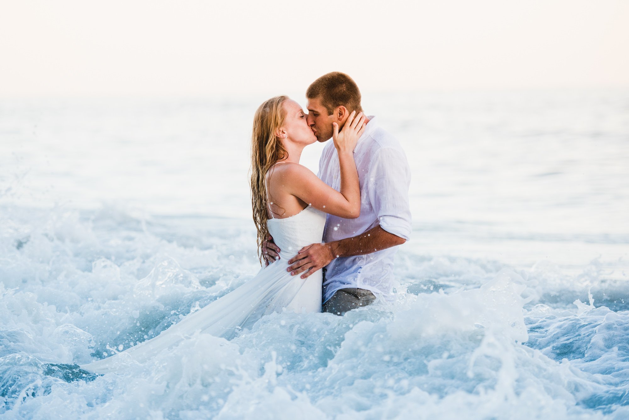 www.santabarbarawedding.com | Grace Kathryn Photography | Couple Kissing in the Waves at Engagement Shoot