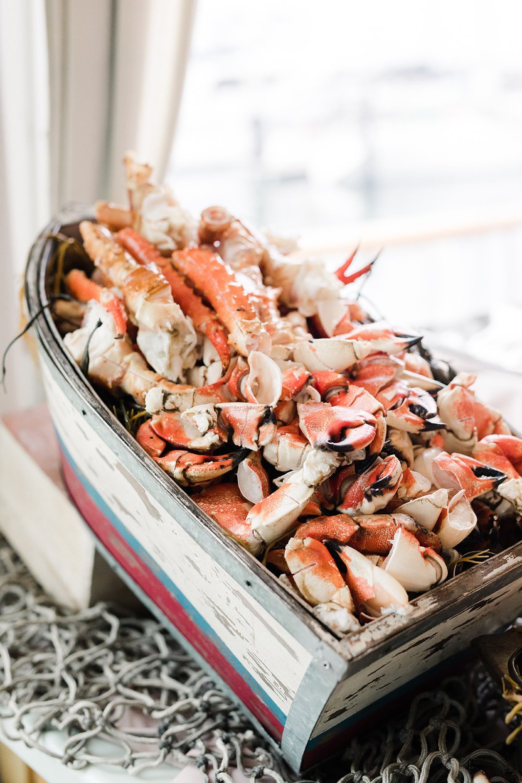 www.santabarbarawedding.com | Anna Delores Photography | Channel Cat Charters | Onyx + Redwood | Catering Connection | Crab Claws in a Bowl Shaped Like a Boat