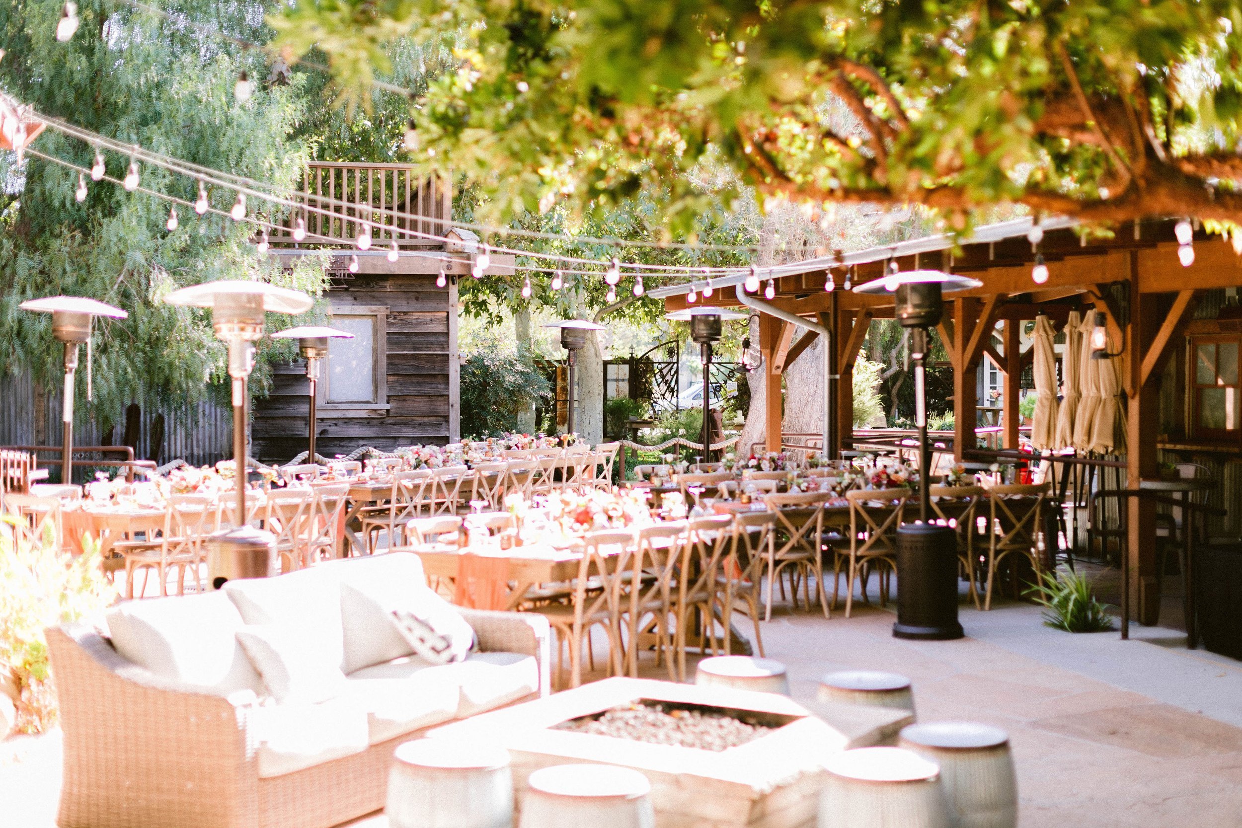 www.santabarbarawedding.com | Brittany Taylor Photography | Swell Studio Events | The Maker’s Son | Alpha Floral | Otis + Pearl | Reception Set Up with Tables, Chairs, String Lights, and a Lounge Area