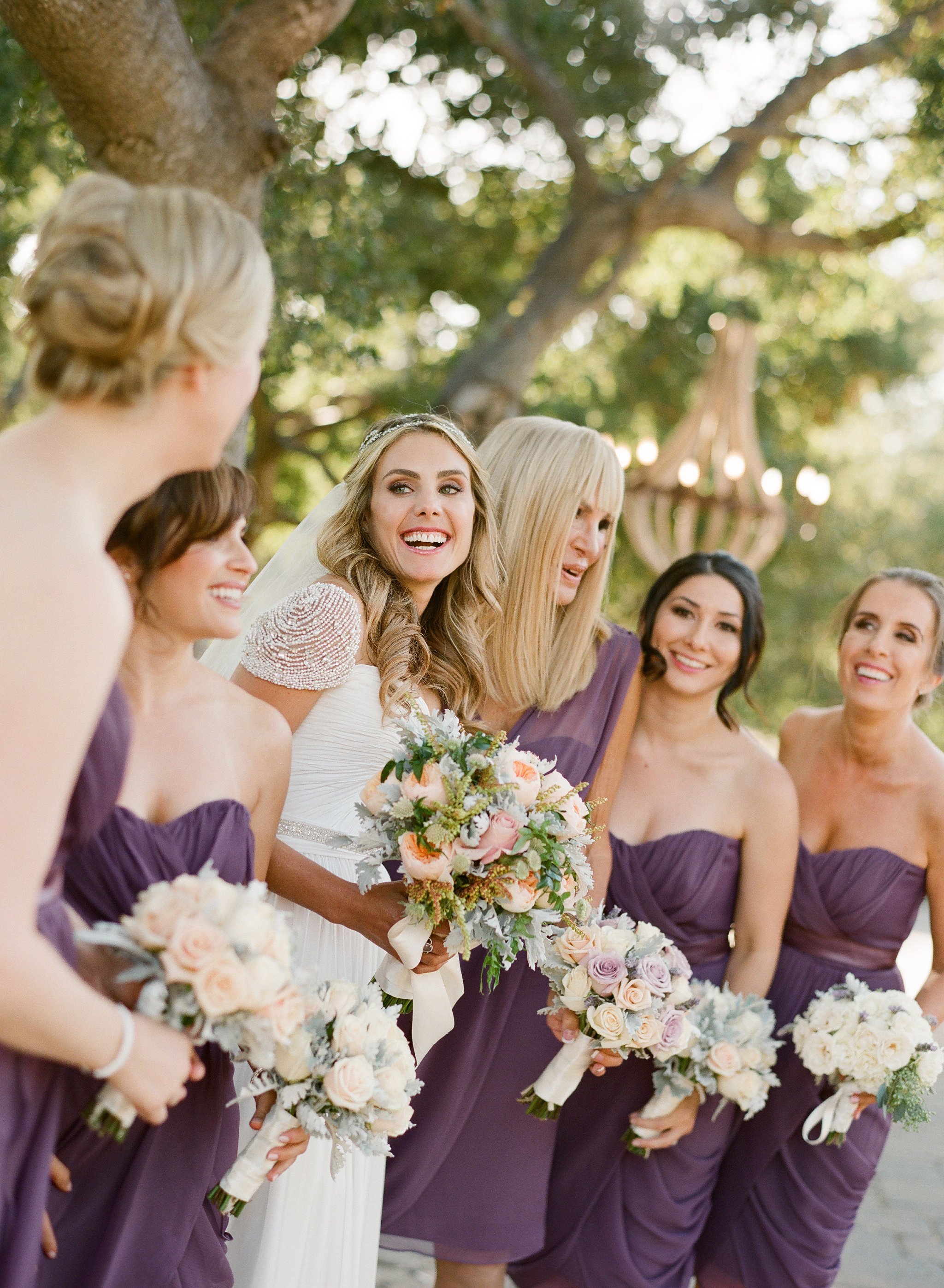 www.santabarbarawedding.com | Megan Sorel Photography | Alexandra Kolendrionos | Bride Surrounded by Bridesmaids in Dark Purple