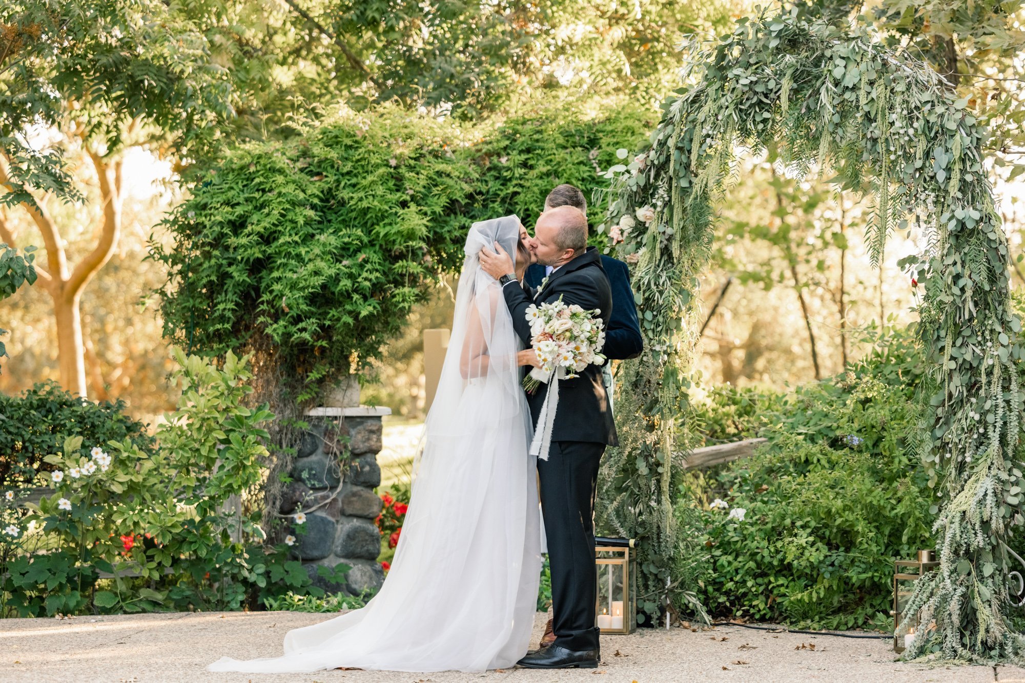 www.santabarbarawedding.com | Santa Ynez Private Residence | Veils &amp; Tails Photography | Santa Ynez Elite Party Rentals | Bride and Groom Kissing at the Ceremony 