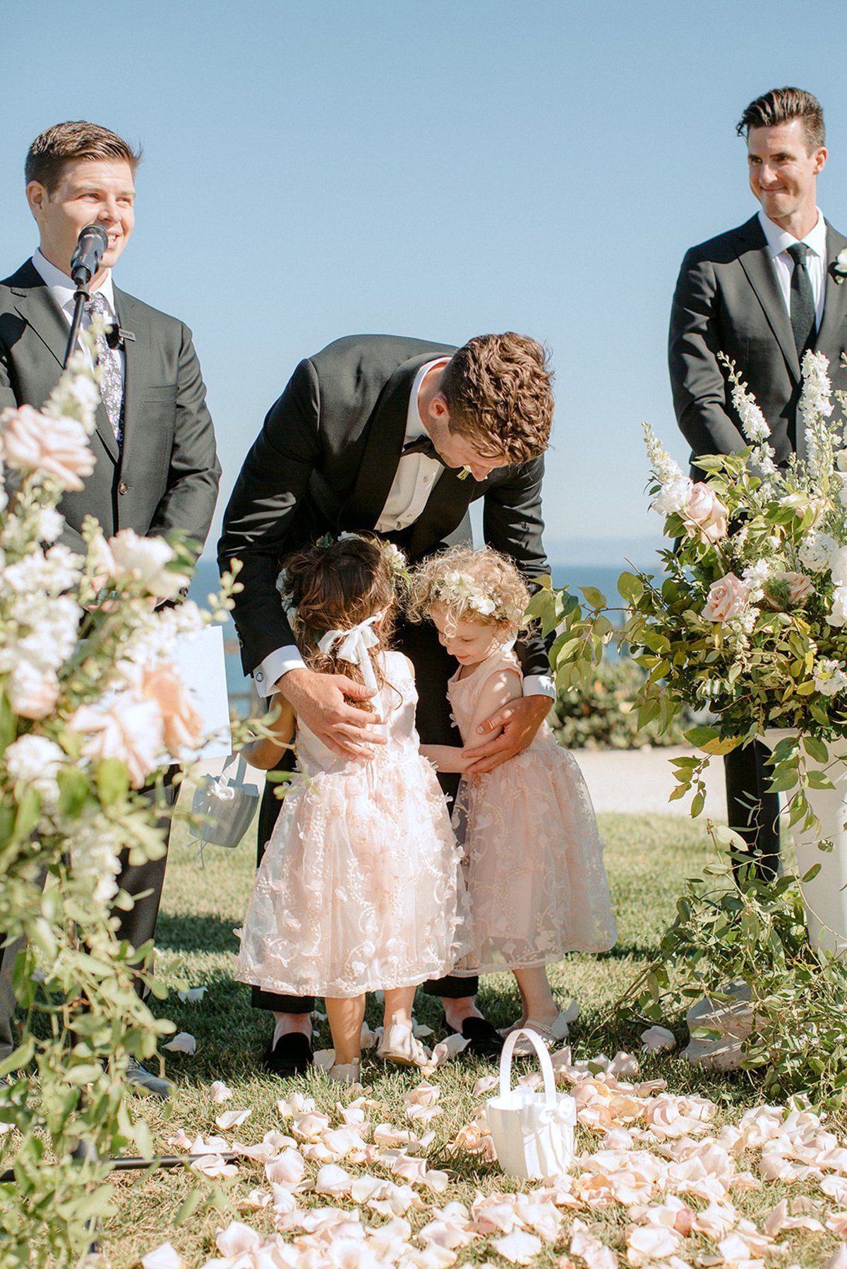 www.santabarbarawedding.com | Ali Beck Photography | LuckEleven Events | The Ritz-Carlton Bacara | Knot Just Flowers | Ralph Lauren | Five Star AV | Two Flower Girls with Groom at Ceremony 