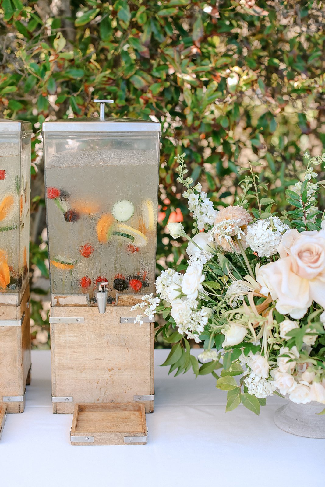 www.santabarbarawedding.com | Ali Beck Photography | LuckEleven Events | The Ritz-Carlton Bacara | Knot Just Flowers | Water Dispensers with Fruit at the Reception 