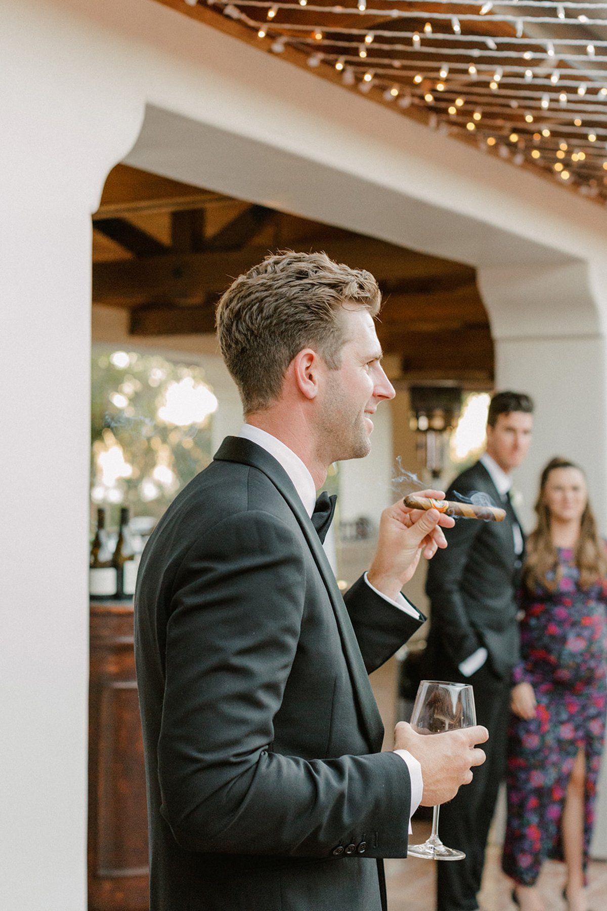 www.santabarbarawedding.com | Ali Beck Photography | LuckEleven Events | The Ritz-Carlton Bacara | Ralph Lauren | VB Cigars | Groom Smoking a Cigar at Reception 