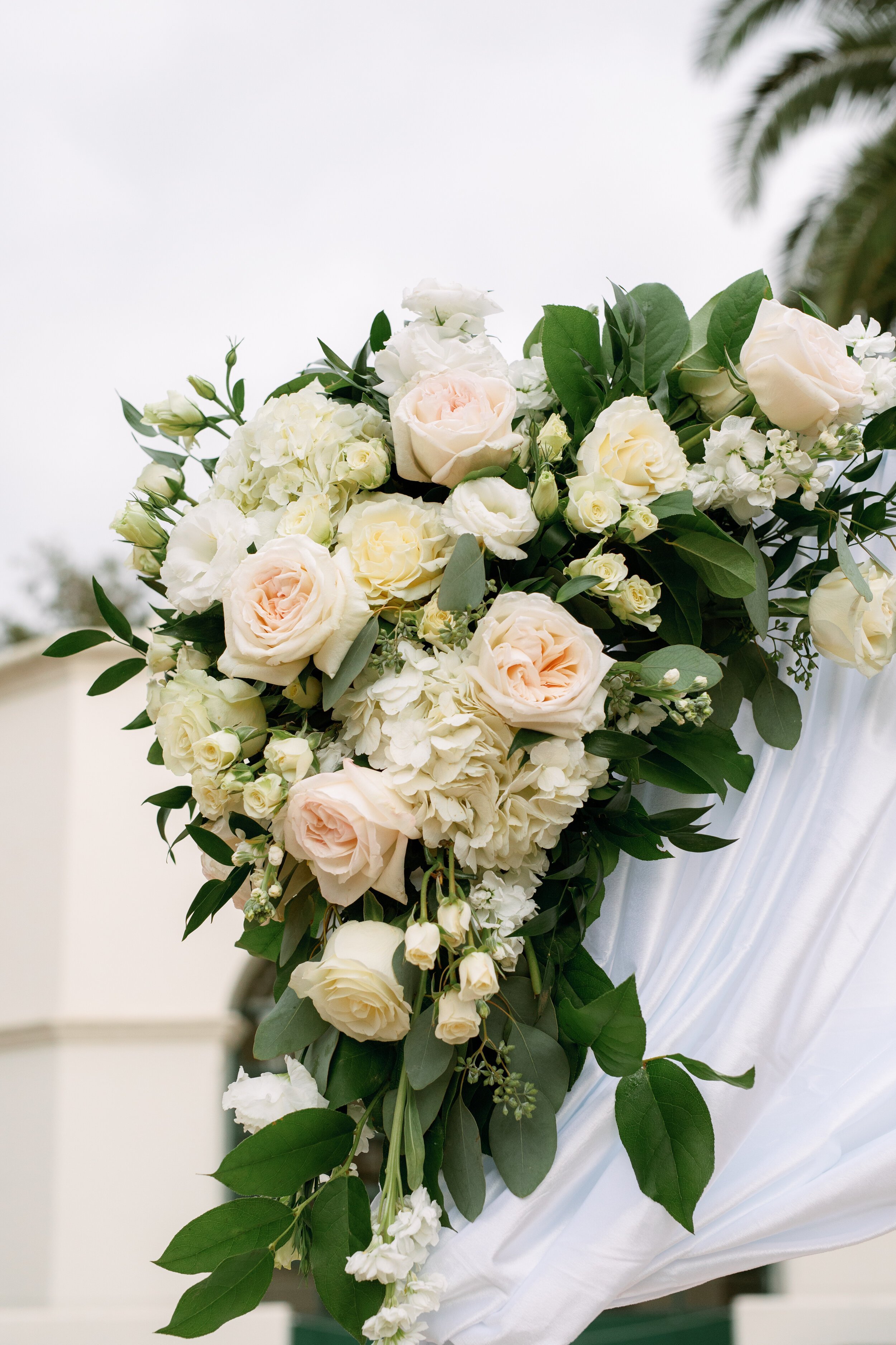 www.santabarbarawedding.com | Tangled Lotus | Anna Delores Photography | Events by Fran | White and Blush Florals on the Wedding Arch 