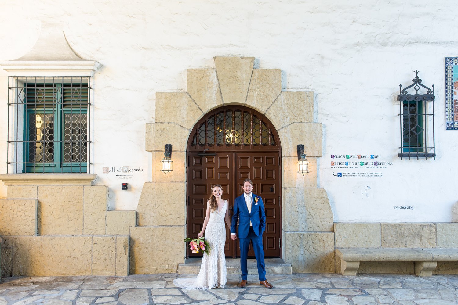 www.santabarbarawedding.com | Santa Barbara Courthouse | Elizabeth Victoria Photography | Hogue &amp; Co. | Floravere | La Rouge Artistry | Bride and Groom in Front of Courthouse Door