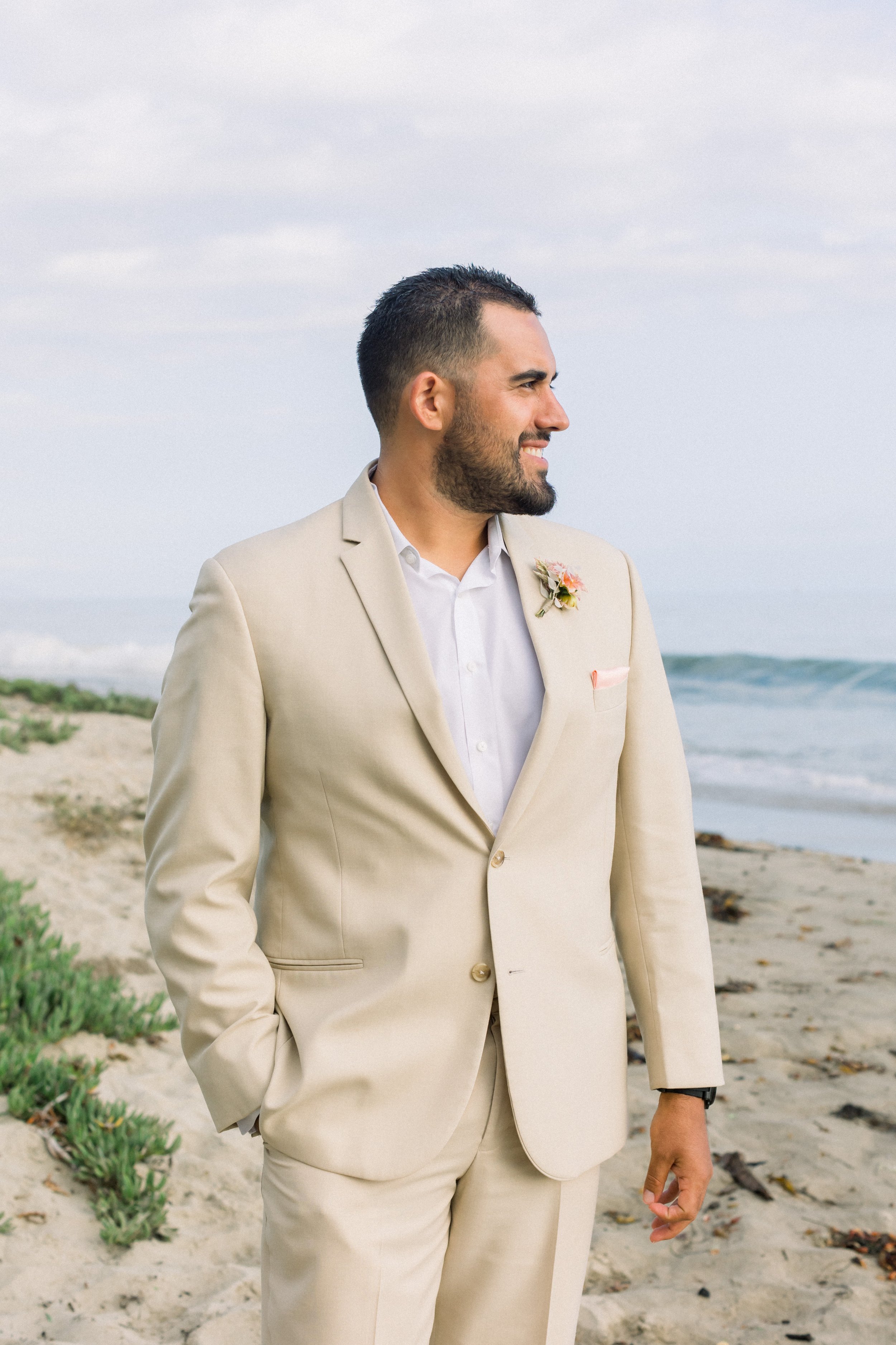 www.santabarbarawedding.com | James &amp; Jess Photography | Slate Catering | All Heart Rentals | Ella &amp; Louie | Groom in His Tan Suit on the Beach