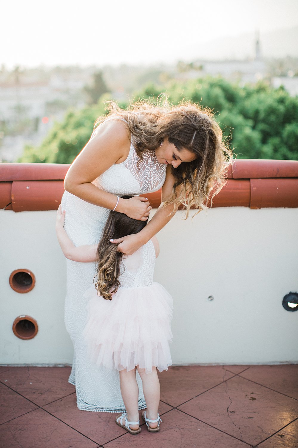 www.santabarbarawedding.com | Michael + Anna Costa Photography | Kimpton Canary | SB Courthouse | LuckEleven Events | Bride Hugging Flower Girl