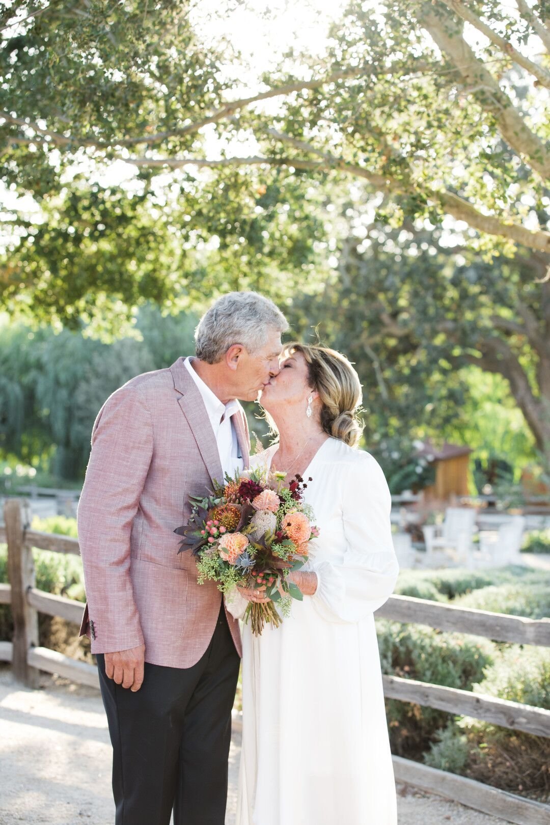 www.santabarbarawedding.com | Venue: Firestone Vineyard | Photographer: Just Kiss Collective | Bride and Groom Kiss