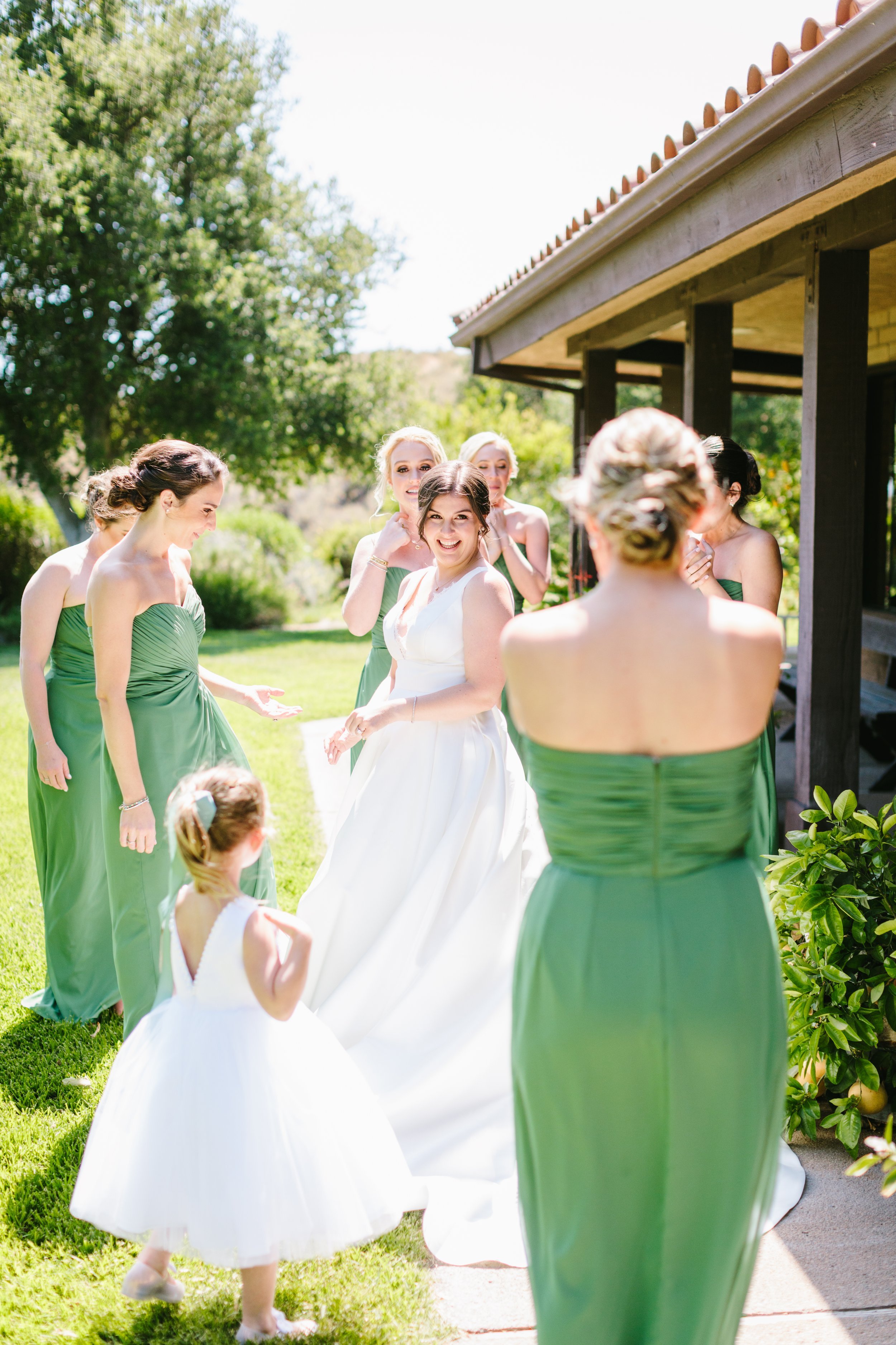 www.santabarbarawedding.com | Foxen Canyon Ranch | Jodee Debes Photography | LVL Weddings |   Jerry Palmer Flowers | Janet Villa | Bride Showing Off to Her Bridesmaids