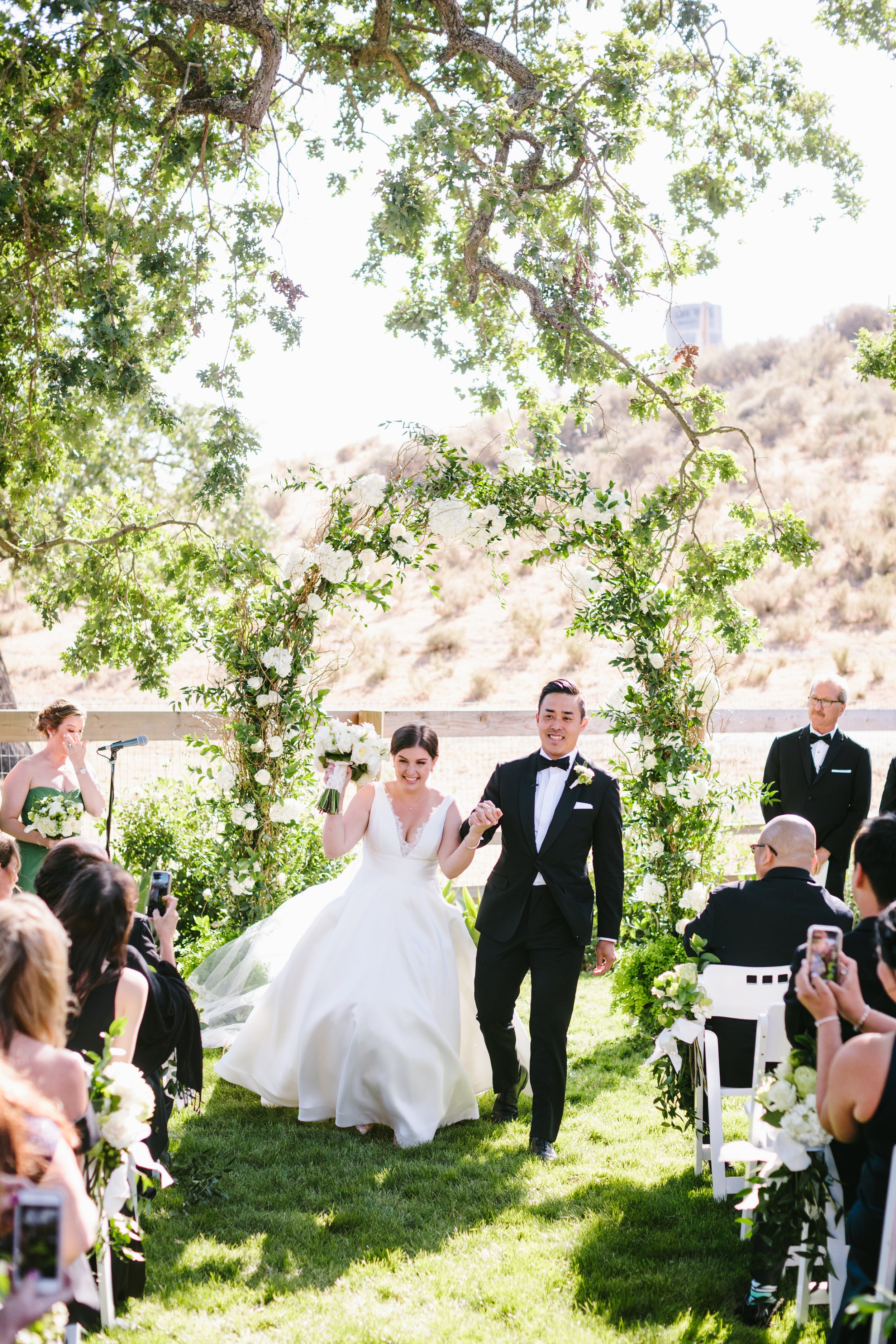 www.santabarbarawedding.com | Foxen Canyon Ranch | Jodee Debes Photography | LVL Weddings |   Jerry Palmer Flowers | Bright Event Rentals | The Society Band | Couple Leaving the Ceremony