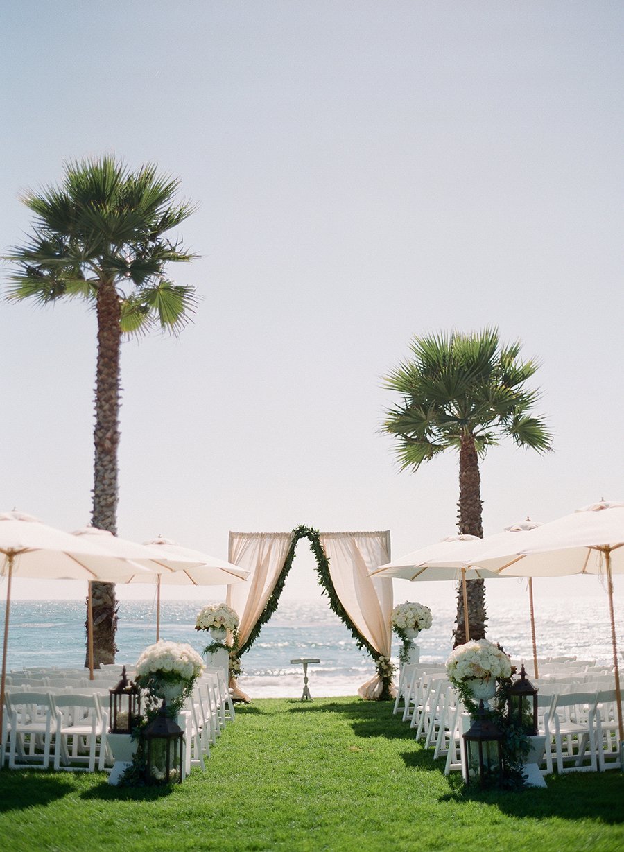 www.santabarbarawedding.com | Lacie Hansen Photography | Ambient Event Design | Drapery on the Wedding Arch with the Ocean in the Background