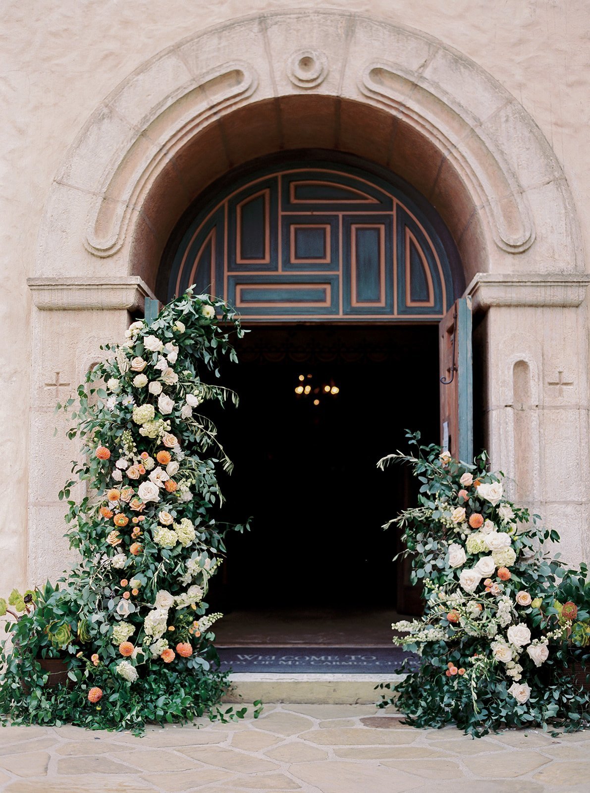 www.santabarbarawedding.com | Kelsey Rae Designs | Our Lady of Mount Carmel | Dani Toscano | Alexis Ireland Florals | Floral Designs Lining the Venue’s Doorway