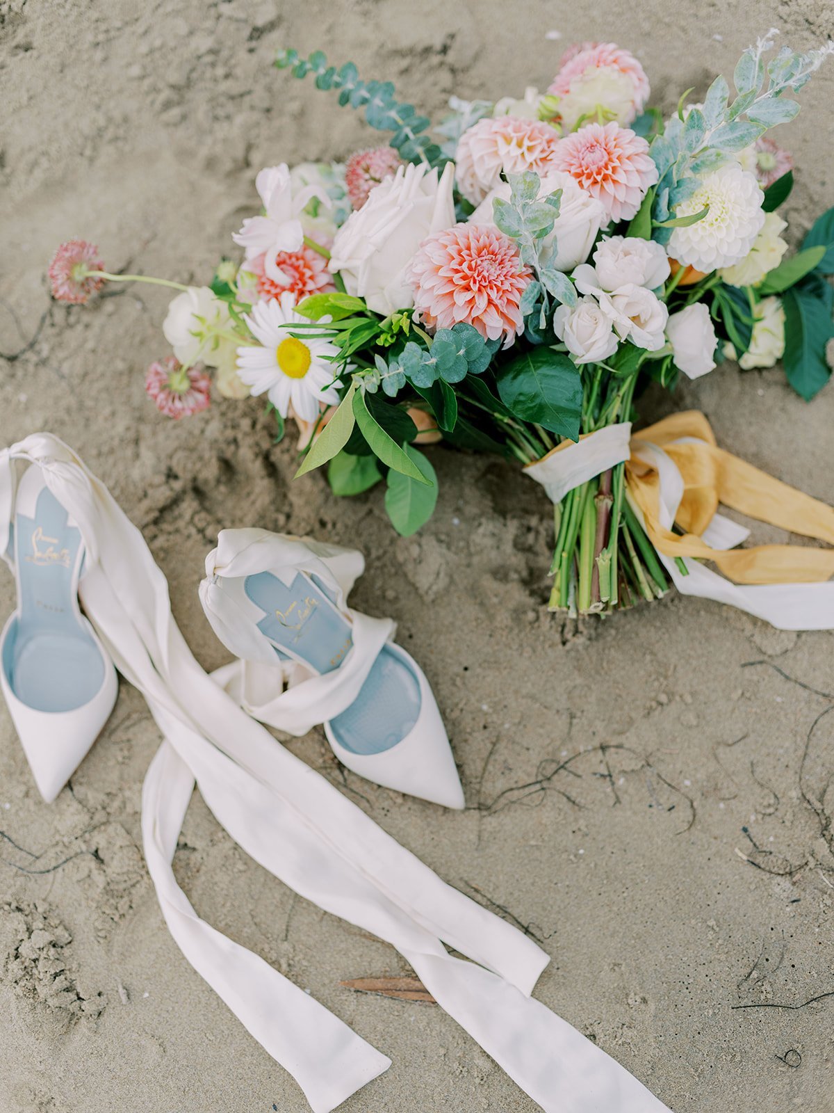 www.santabarbarawedding.com | Kelsey Rae Designs | Dani Toscano | Alexis Ireland Florals | Christian Louboutin | Bride’s Shoes and Bouquet in the Sand