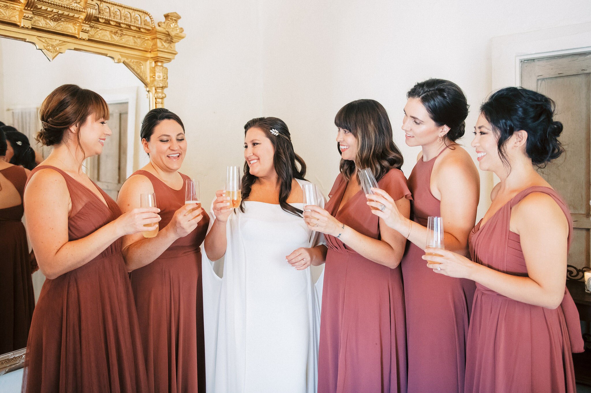 www.santabarbarawedding.com | Santa Barbara Historical Museum | Grace Kathryn | White Sage Wedding &amp; Events | Bride Shares a Drink with Bridesmaids
