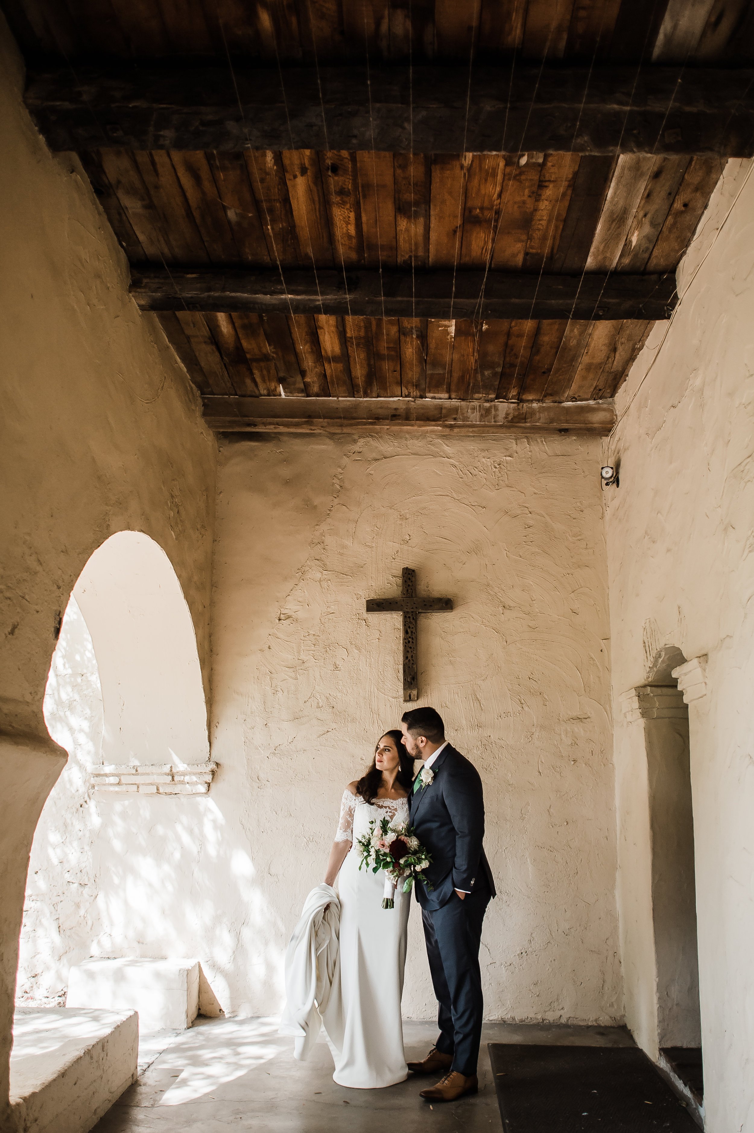 www.santabarbarawedding.com | Michelle Ramirez Photography | Old Mission Santa Ines | Amazing Day Events | Sweet Peas Flowers and Gifts | The Couple Share a Moment at the Church